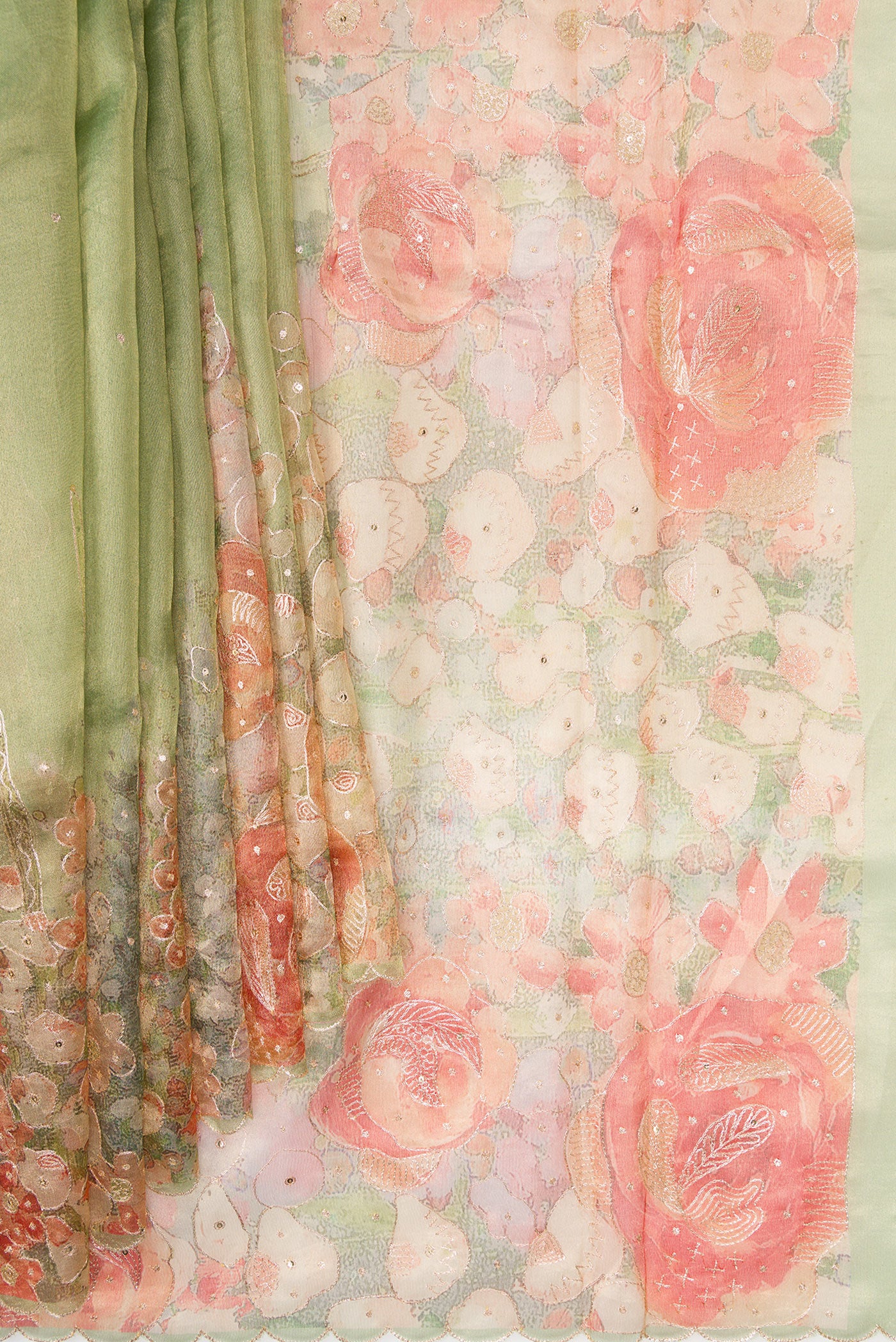 Pleats and pallu of Pista Green Dual Tone Organza Silk Saree with Embroidery on the body and Embroidery Border. 