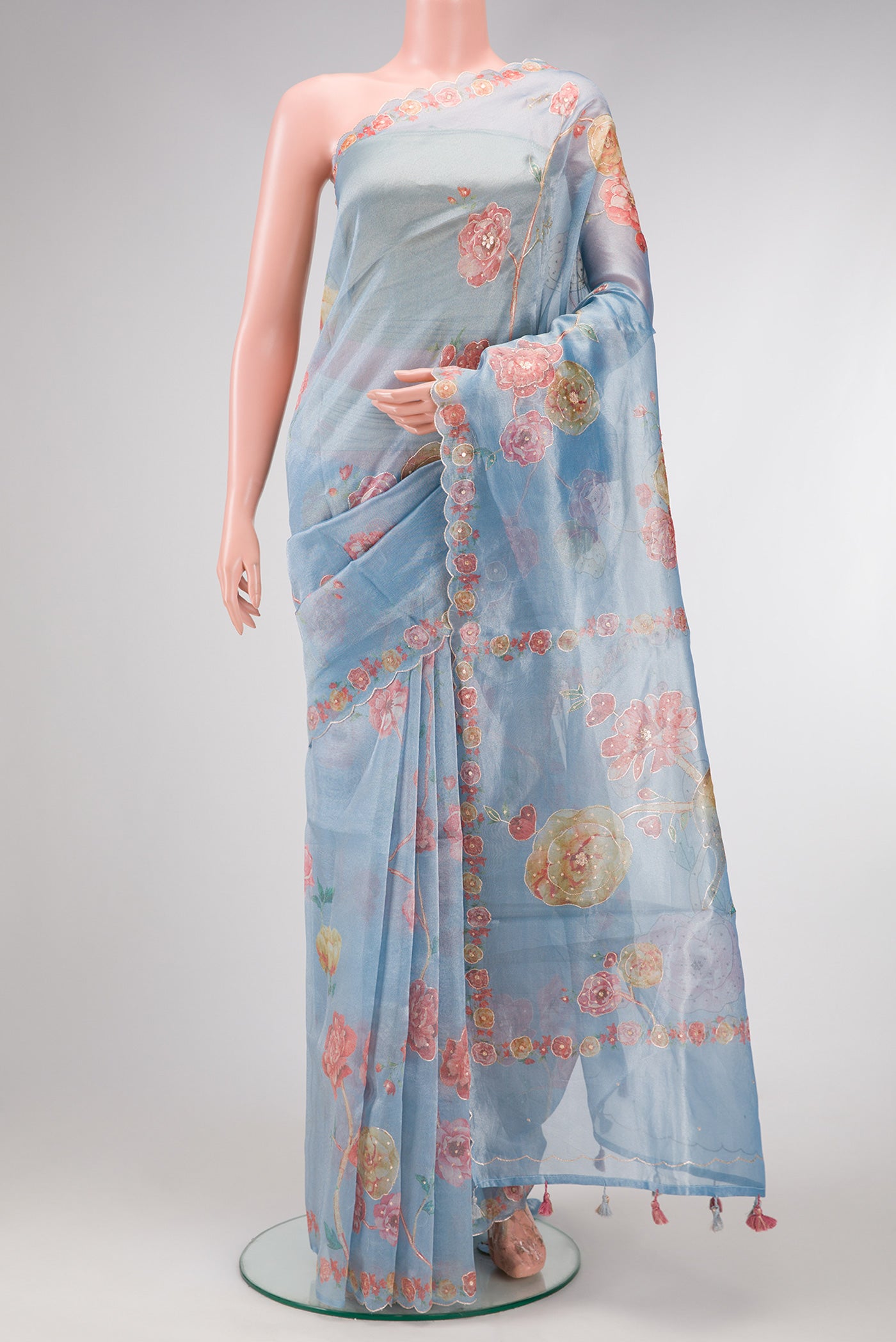 Grey Dual Tone Organza Silk Saree with Embroidery on the body and Embroidery Border.  displayed on a mannequin