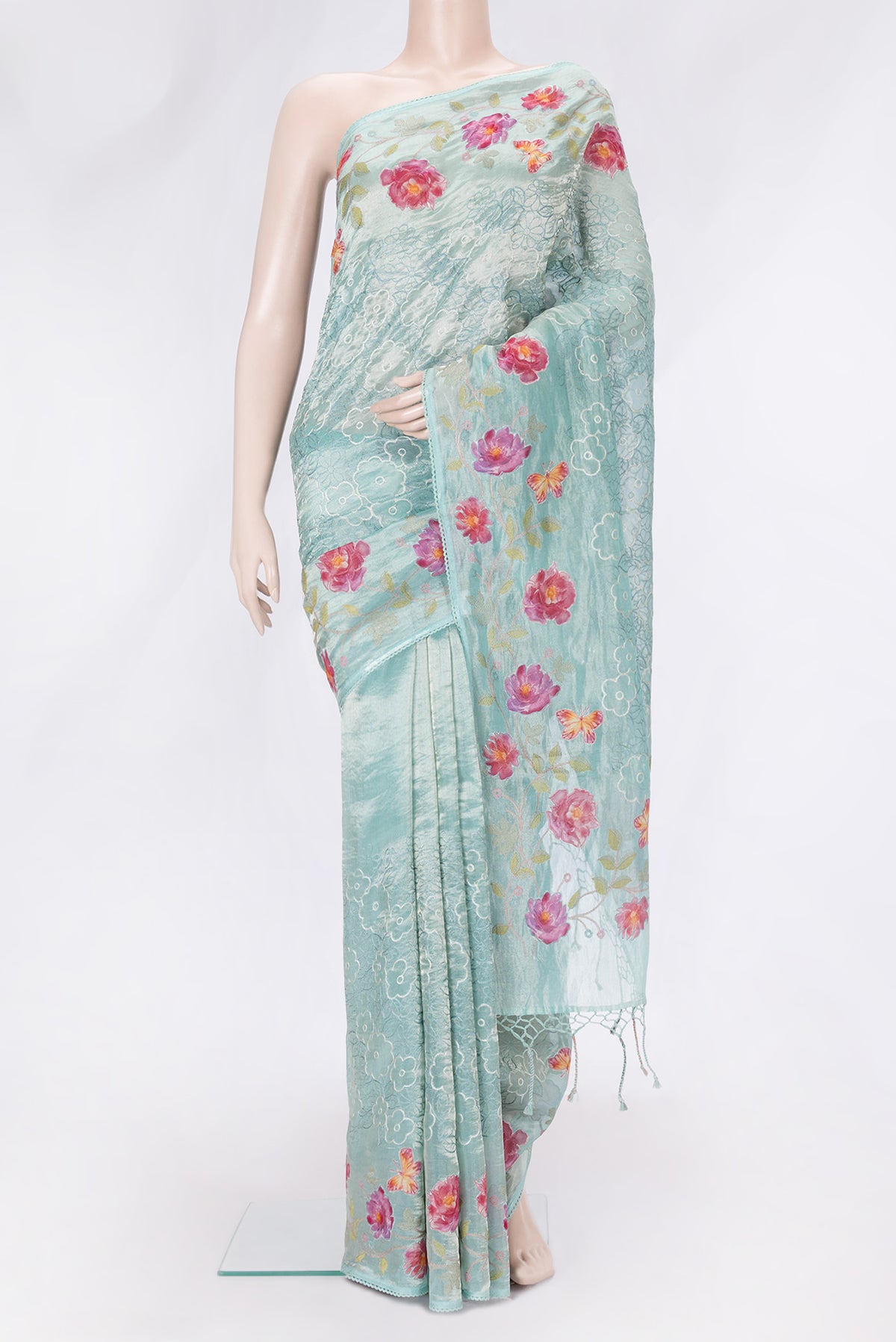 Sea Green Dual Tone Organza Silk Saree with Embroidery on the body and Embroidery Border.  displayed on a mannequin