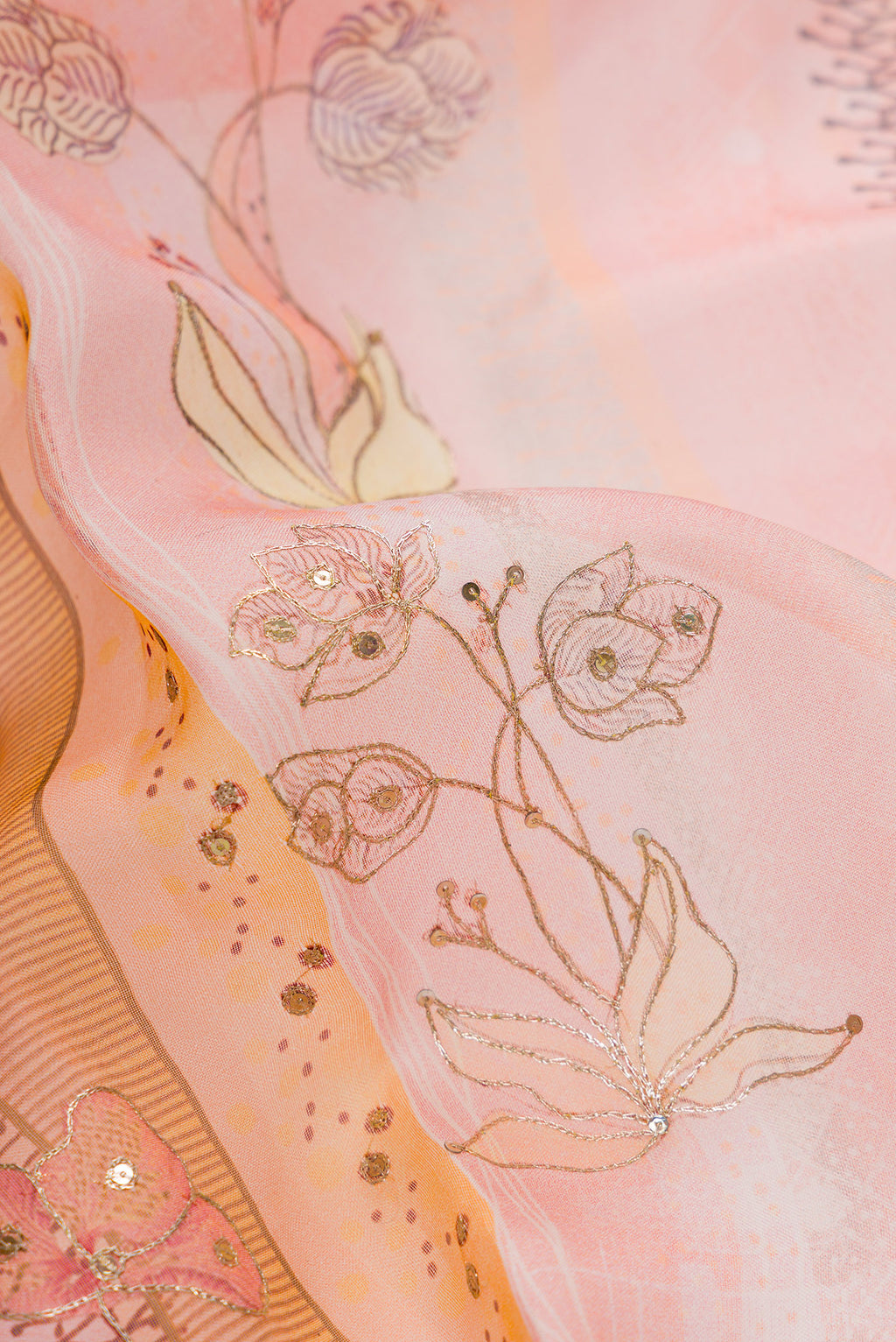 Close up of Pink Dual Tone Organza Silk Saree with Embroidery on the body and Embroidery Border.  displaying folds
