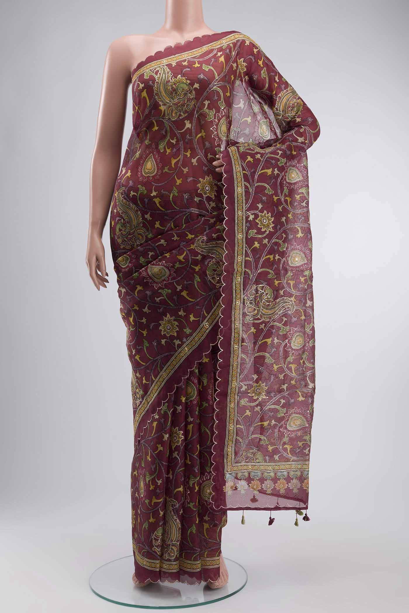 Maroon Organza Silk Saree with Floral Print on the body and Printed Border displayed on a mannequin