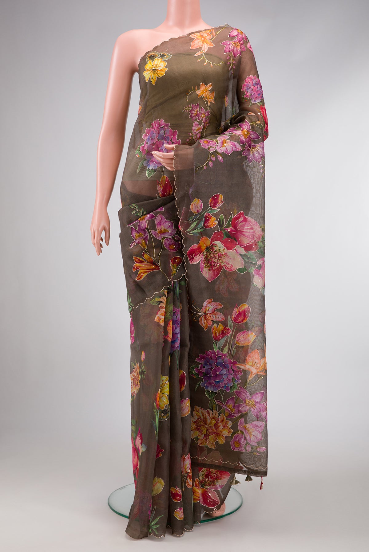 Brown Dual Tone Organza Silk Saree with Printed design on the body and Embroidery Border.  displayed on a mannequin