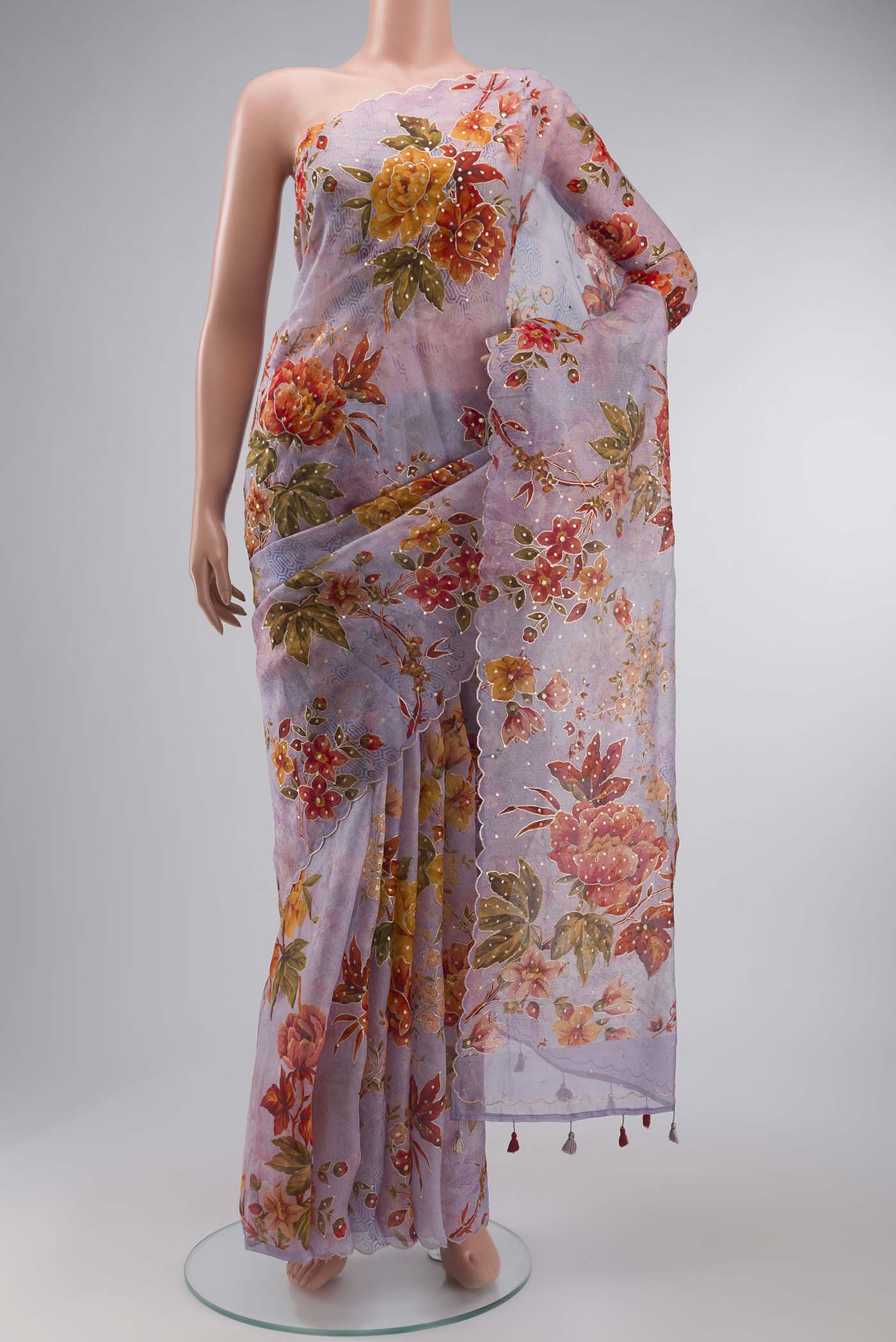 Lavender Organza Silk Saree with Embroidery on the body and Without Border displayed on a mannequin