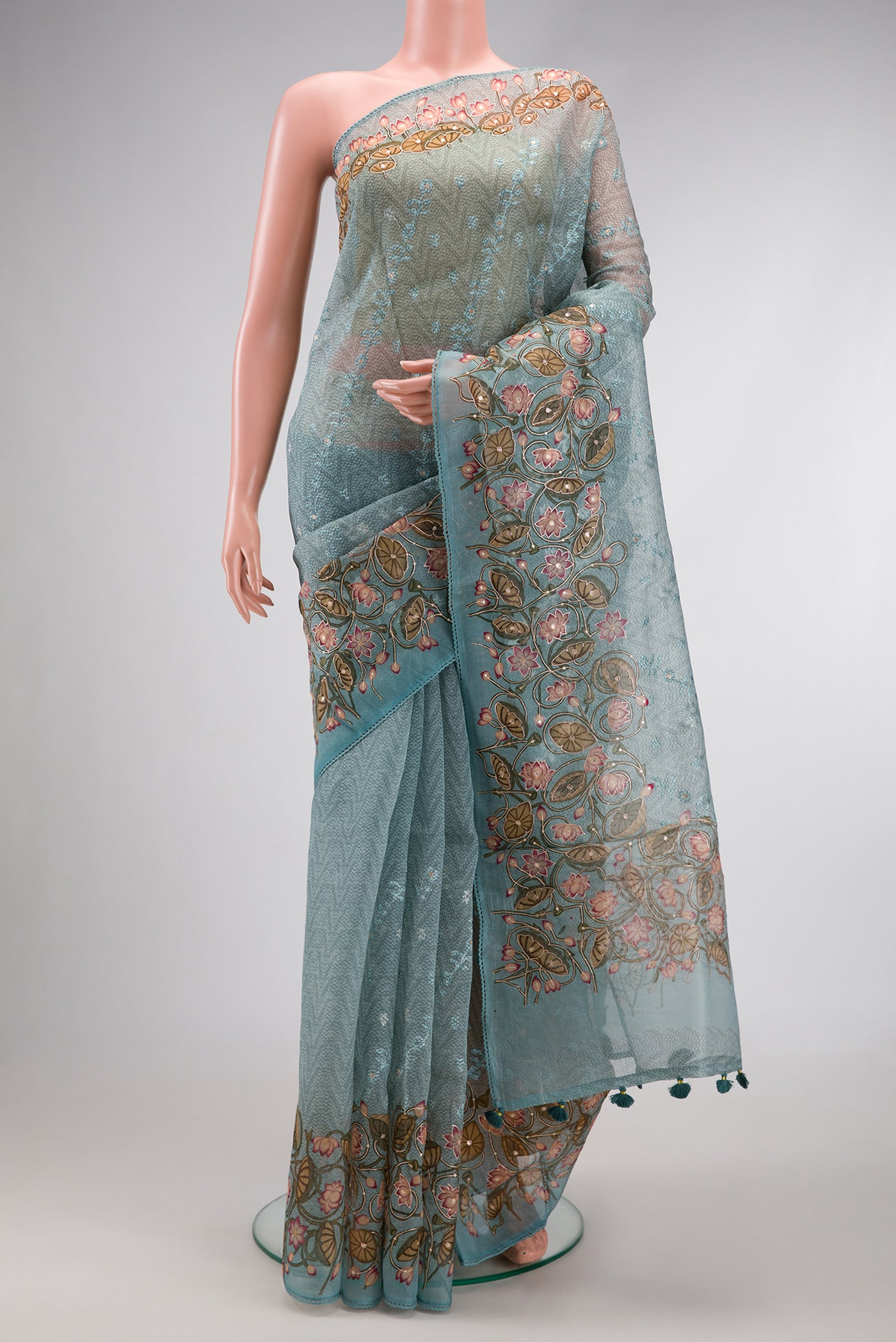 Maya Blue Dual Tone Organza Silk Saree with Embroidery on the body and Embroidery Border.  displayed on a mannequin