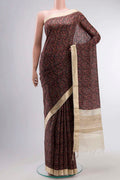 Black Tussar Silk Saree with Printed design on the body and Zari Border displayed on a mannequin
