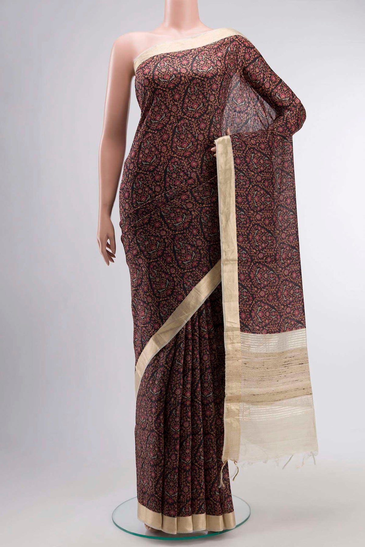 Black Tussar Silk Saree with Printed design on the body and Zari Border displayed on a mannequin