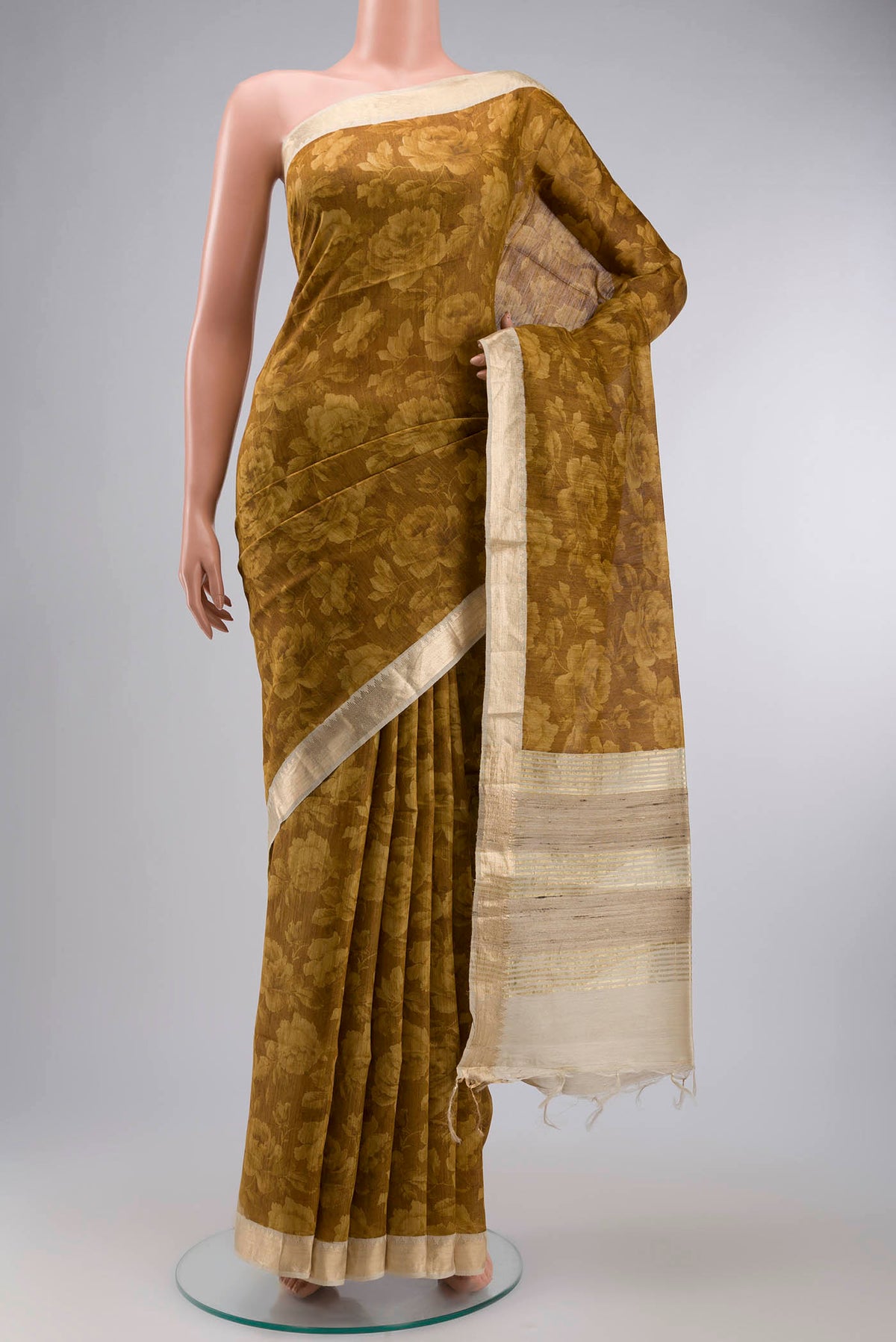 Mustard Bhagalpuri Tussar Silk Saree with Printed design on the body and Zari Border displayed on a mannequin
