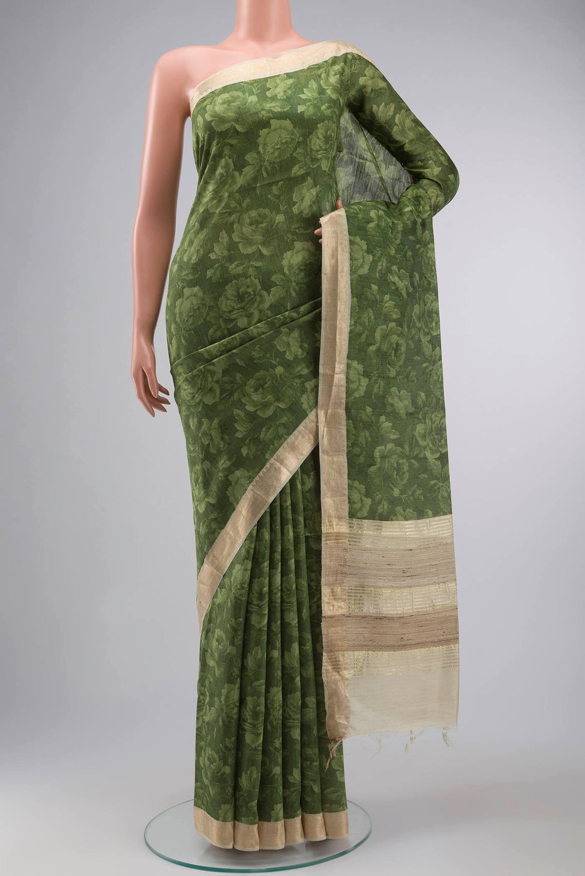 Green Bhagalpuri Tussar Silk Saree with Floral Print on the body and Zari Border displayed on a mannequin