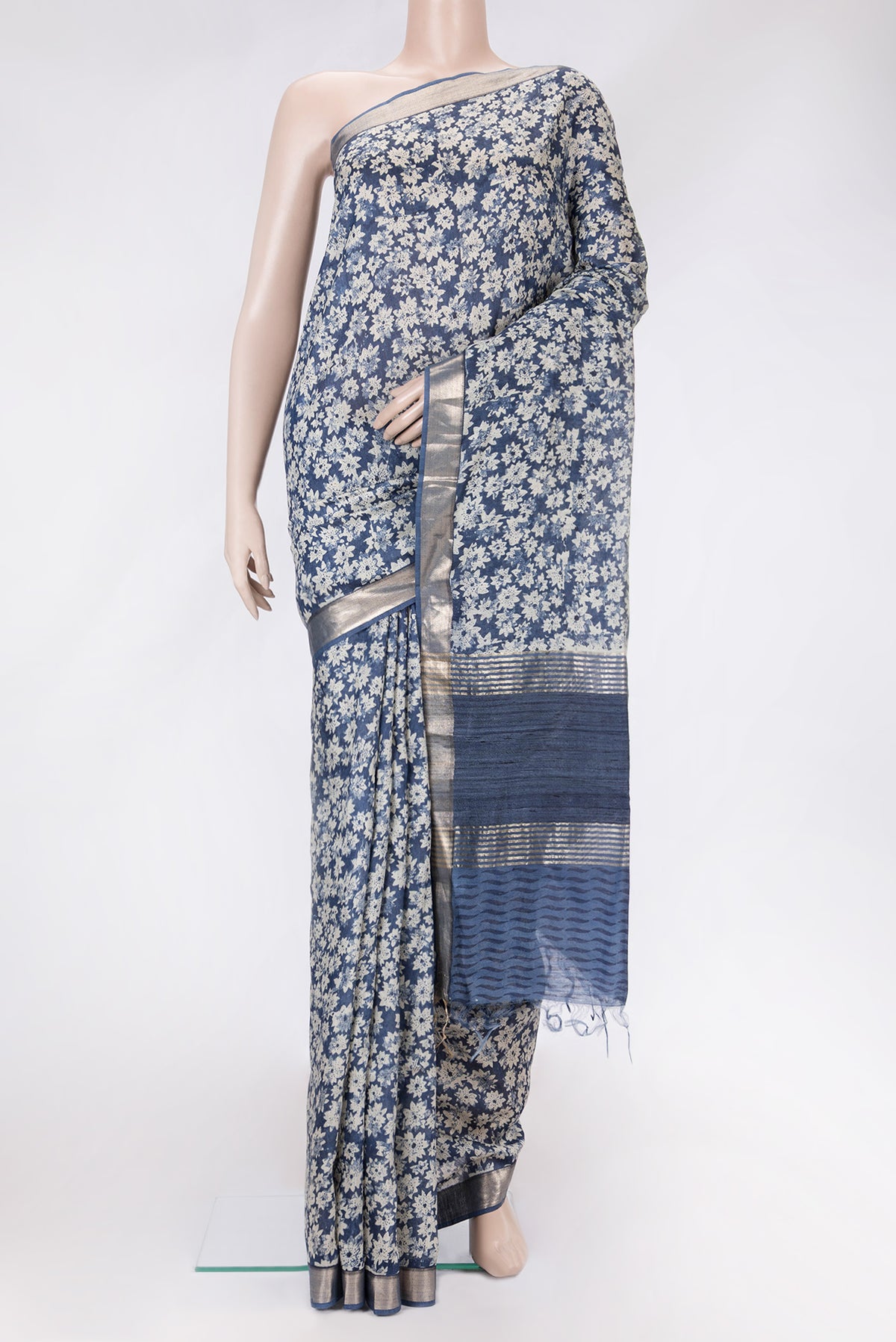 Blue Dual Tone Tussar Silk Saree with Printed design on the body and Zari Border.  displayed on a mannequin