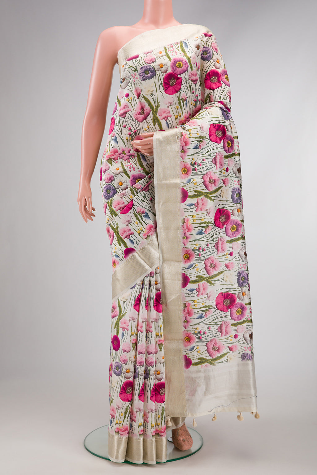 Off White Dual Tone Tussar Silk Saree with Printed design on the body and Zari Border.  displayed on a mannequin