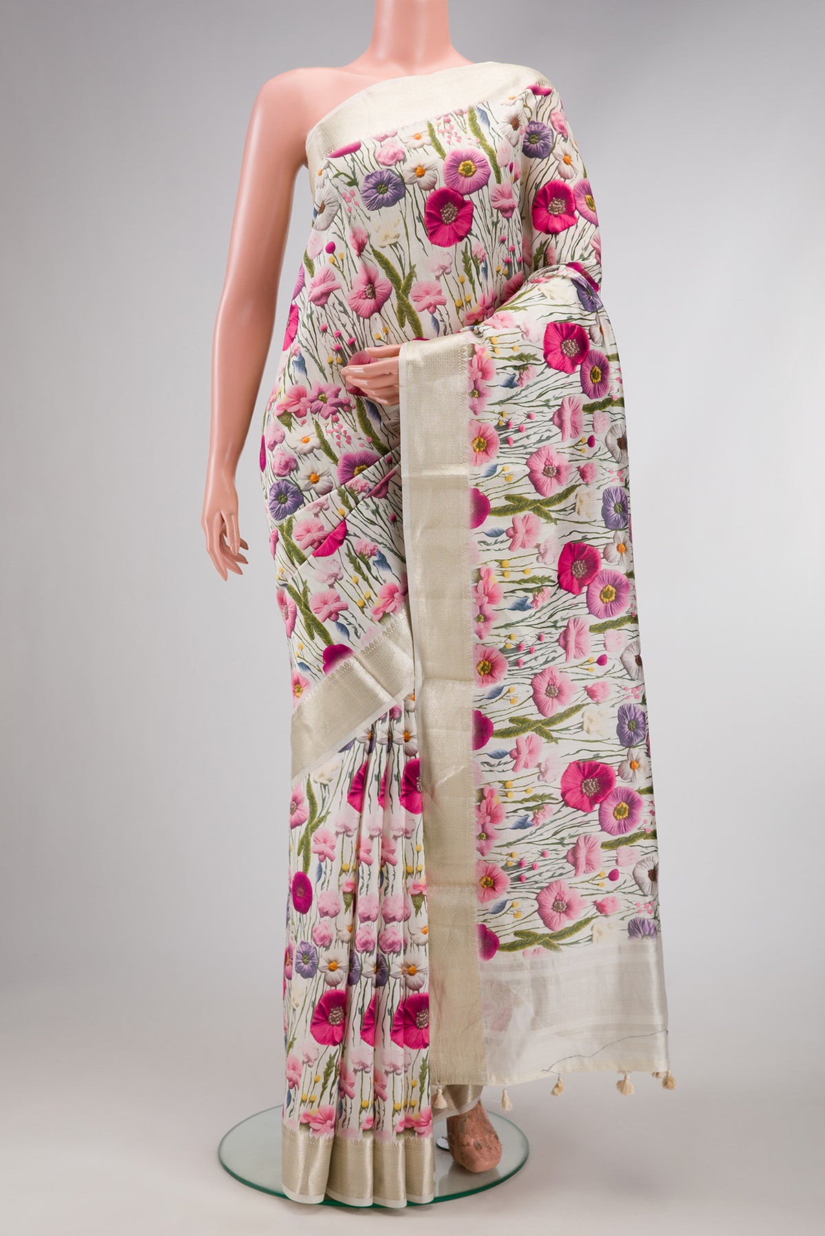 Off White Dual Tone Tussar Silk Saree with Printed design on the body and Zari Border.  displayed on a mannequin