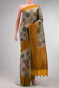 Grey Dual Tone Tussar Silk Saree with Printed design on the body and Fancy Border.  displayed on a mannequin