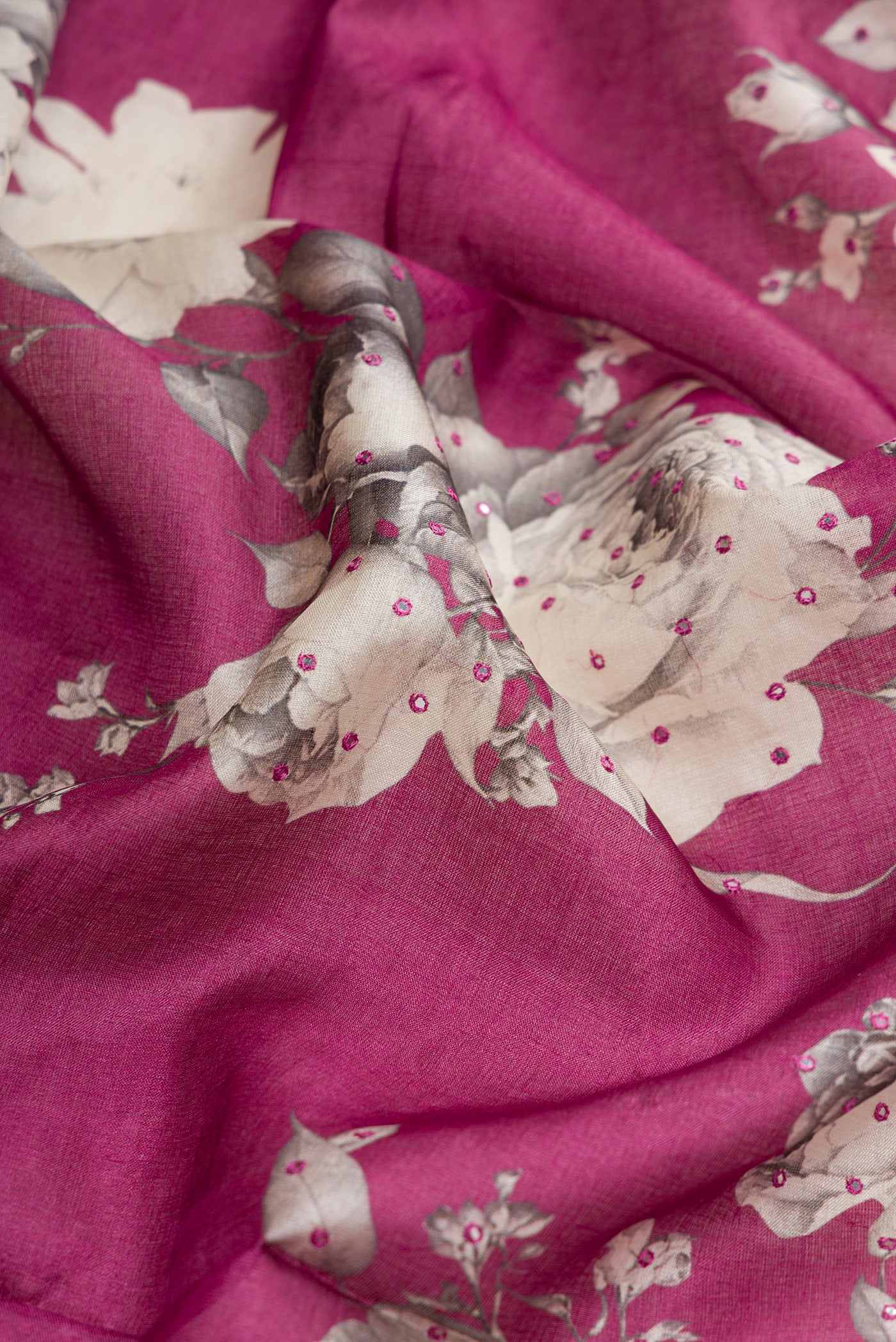 Close up of Purple Dual Tone Tussar Silk Saree with Printed design on the body and Without Border.  displaying folds