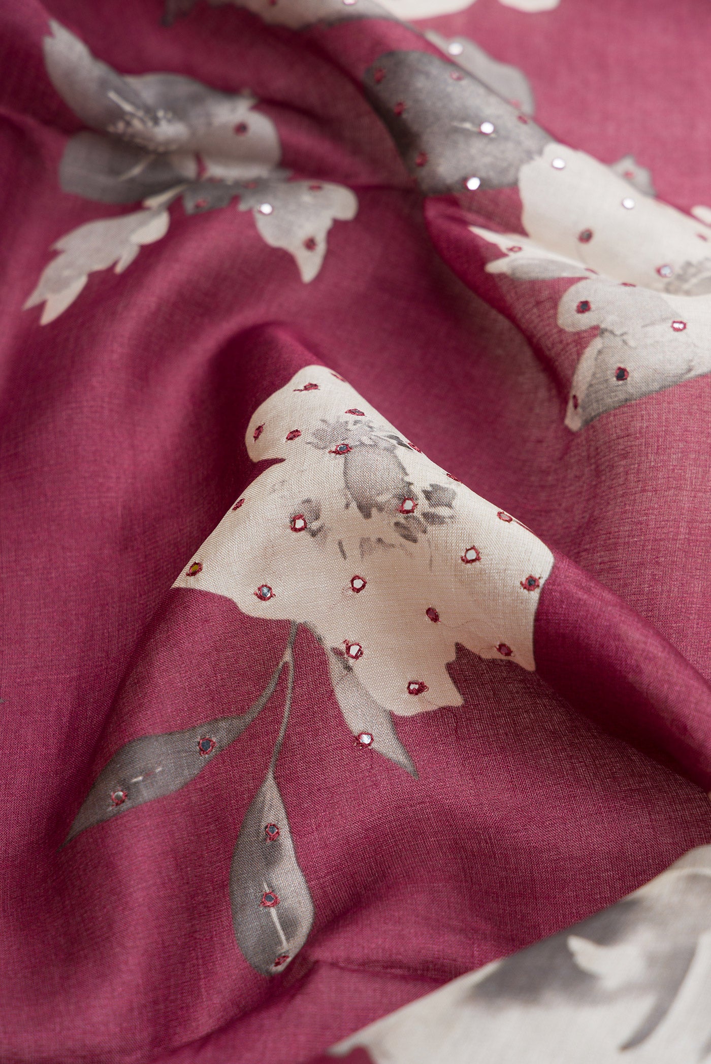 Close up of Mauve Dual Tone Tussar Silk Saree with Printed design on the body and Without Border.  displaying folds