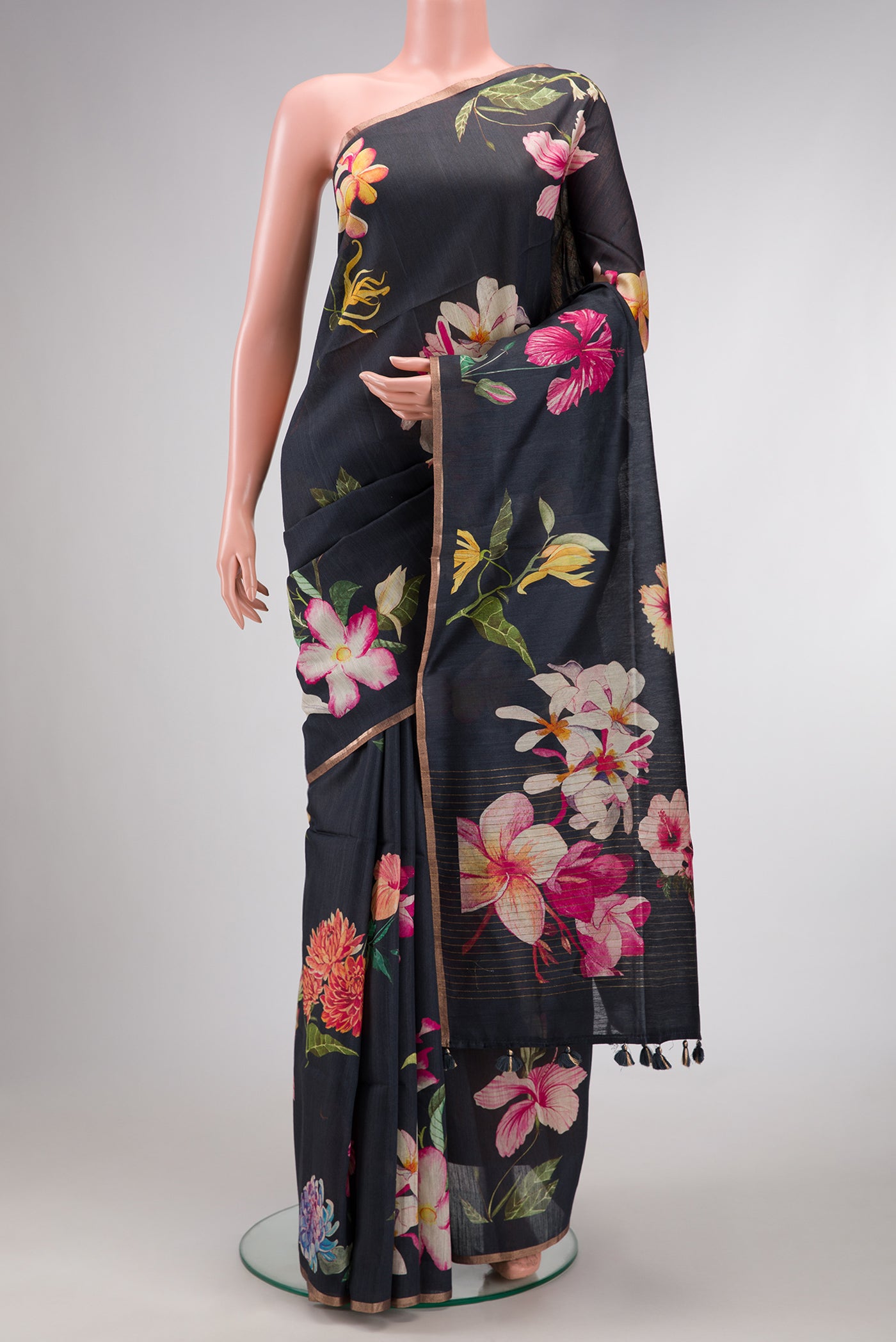 Grey Dual Tone Tussar Silk Saree with Printed design on the body and Thin Zari Line.  displayed on a mannequin