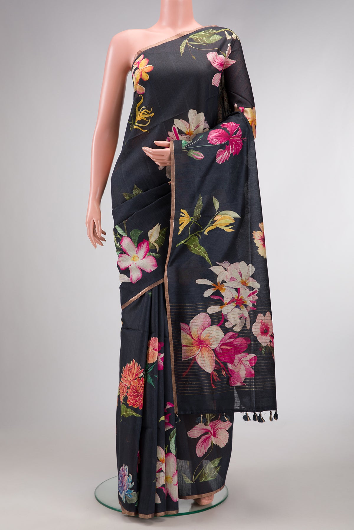 Grey Dual Tone Tussar Silk Saree with Printed design on the body and Thin Zari Line.  displayed on a mannequin