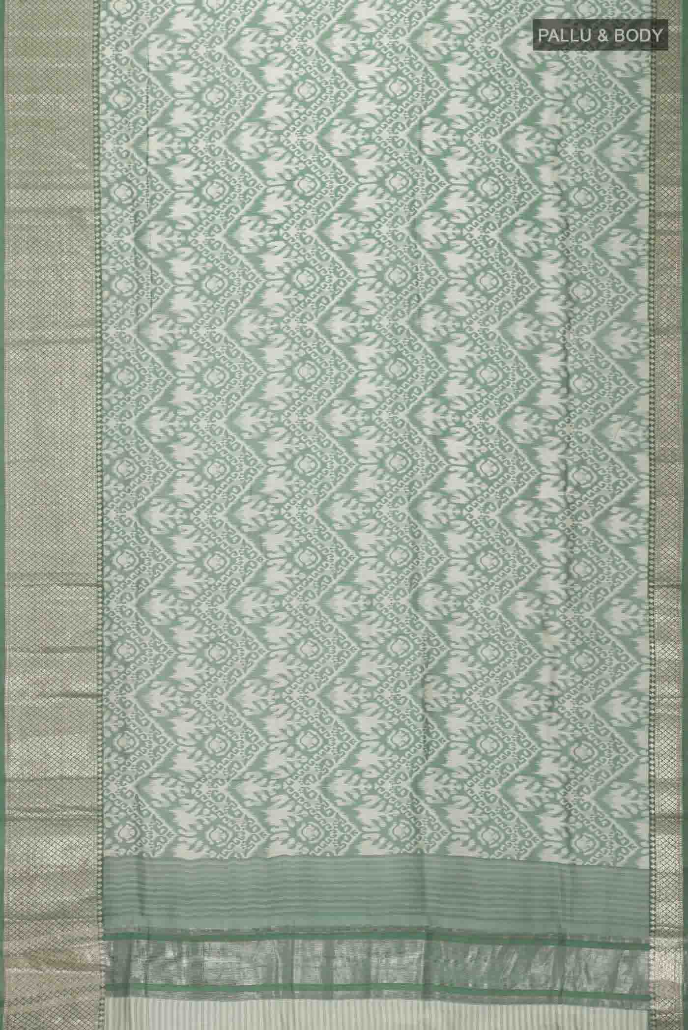 Flat view of Green Tussar Silk Saree with Printed design on the body and Zari Border