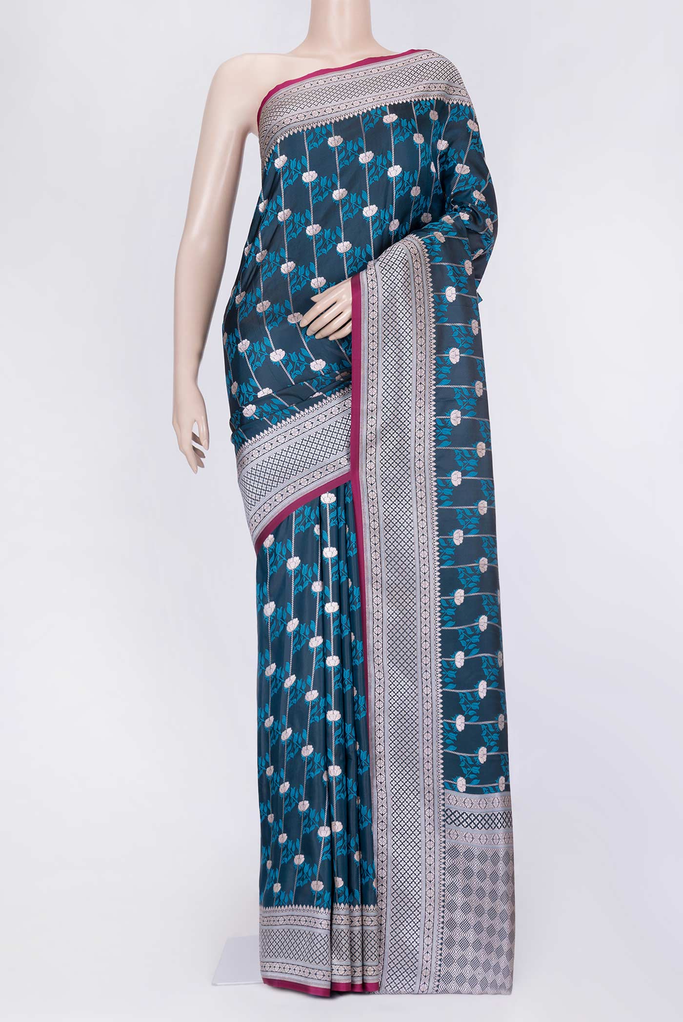 Peacock Blue Dual Tone Blended Banarasi Silk Saree with Zari Butta on the body and Zari Border.  displayed on a mannequin