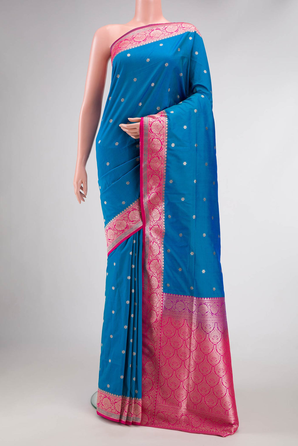 Peacock Blue Dual Tone Blended Banarasi Silk Saree with Zari Butta on the body and Zari Border.  displayed on a mannequin
