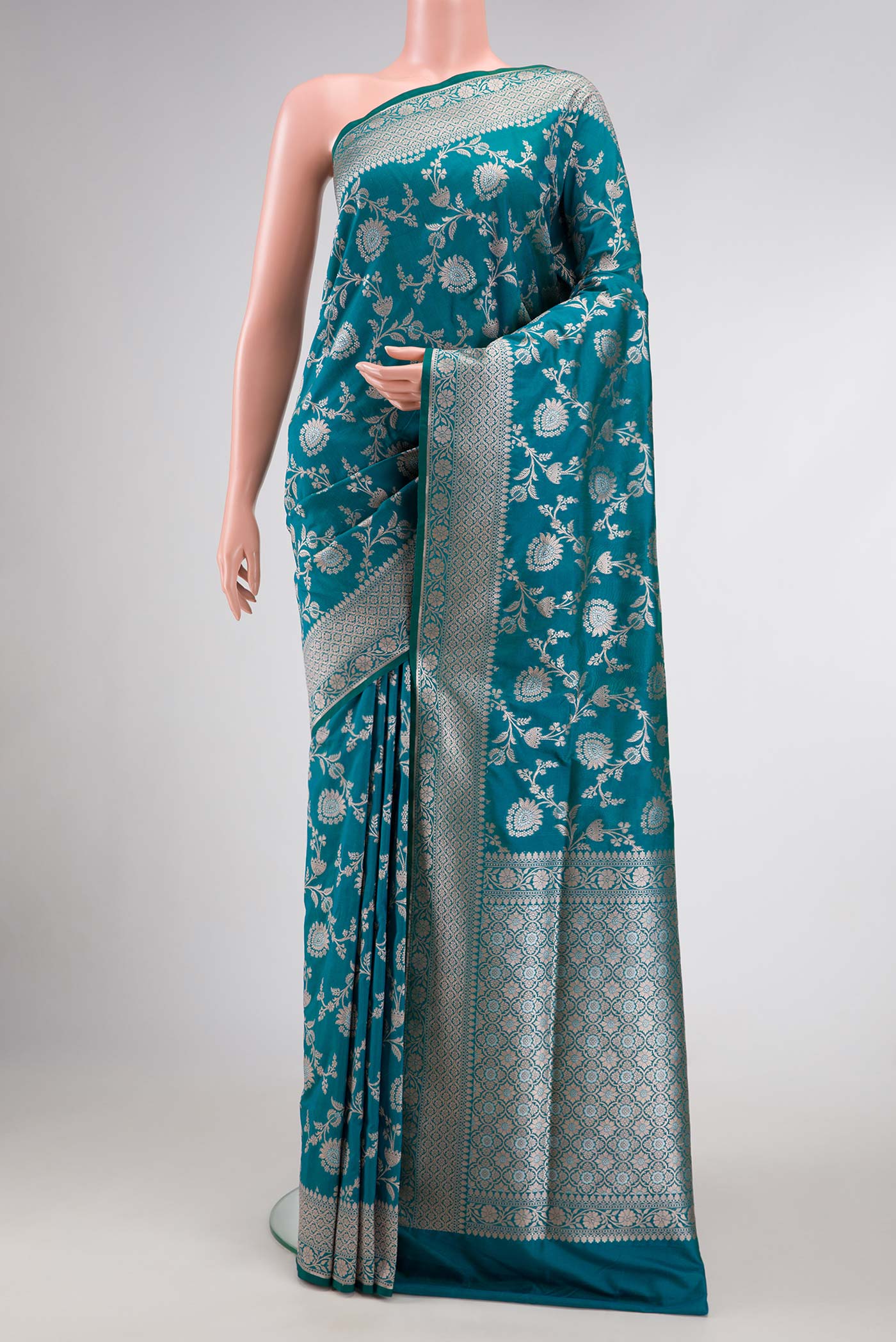 Peacock Blue Dual Tone Blended Banarasi Silk Saree with Zari Brocade on the body and Zari Border.  displayed on a mannequin