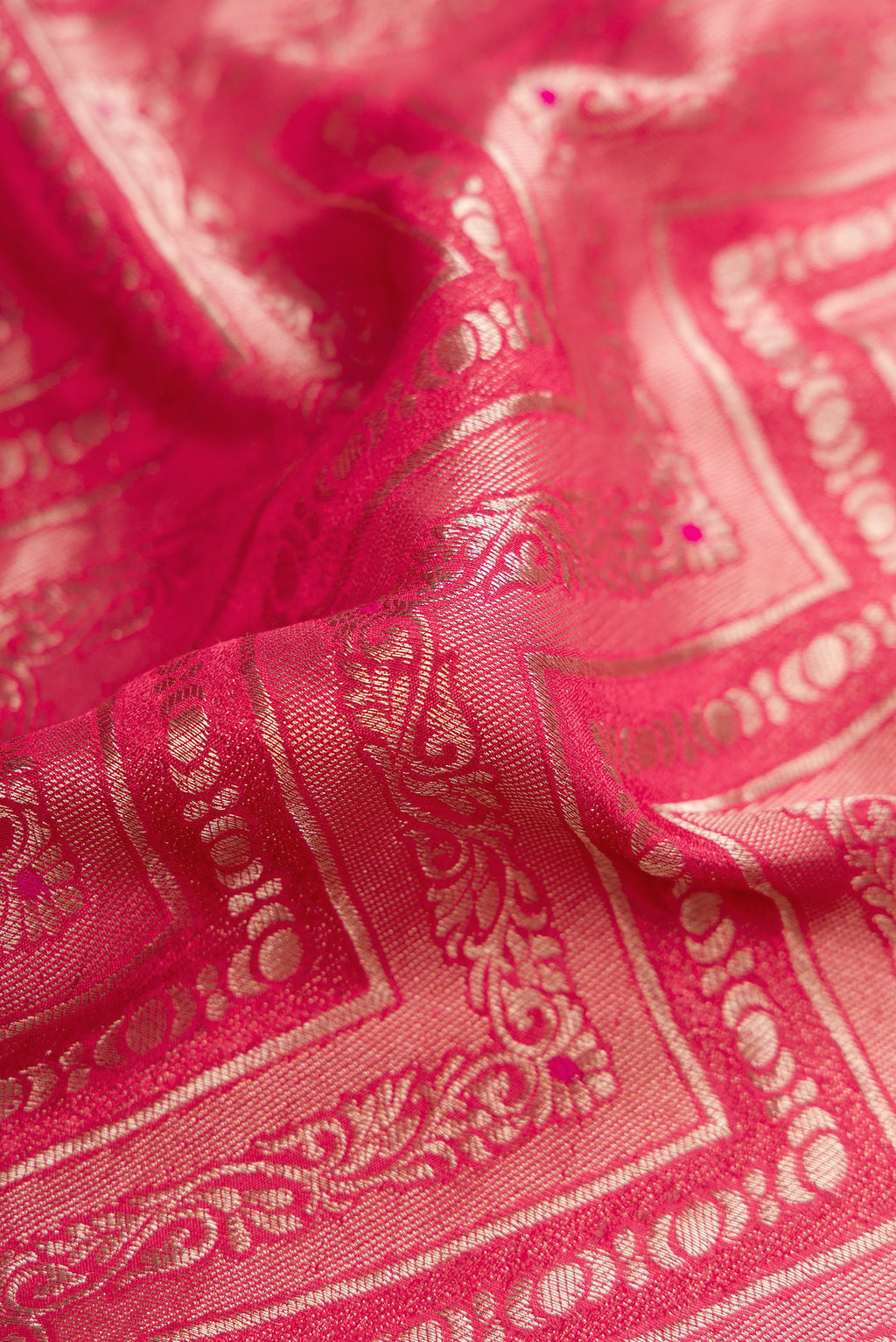Close up of Pink Dual Tone Mysore Crepe Saree with Zari Brocade on the body and Zari Border.  displaying folds