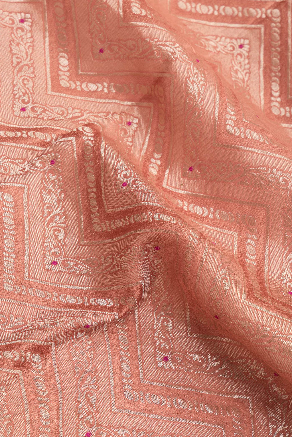Close up of Brick Orange Dual Tone Banarasi Georgette Saree with Zari Brocade on the body and Zari Border.  displaying folds