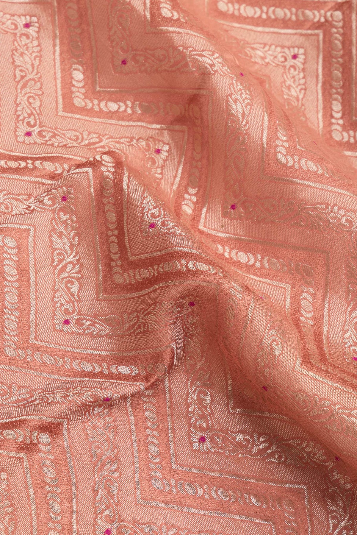 Close up of Brick Orange Dual Tone Banarasi Georgette Saree with Zari Brocade on the body and Zari Border.  displaying folds