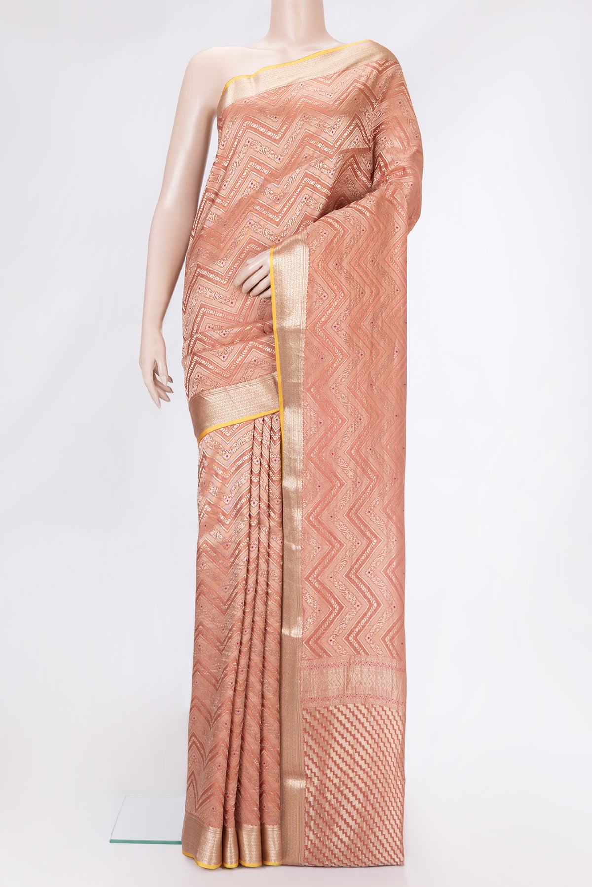 Brick Orange Dual Tone Banarasi Georgette Saree with Zari Brocade on the body and Zari Border.  displayed on a mannequin