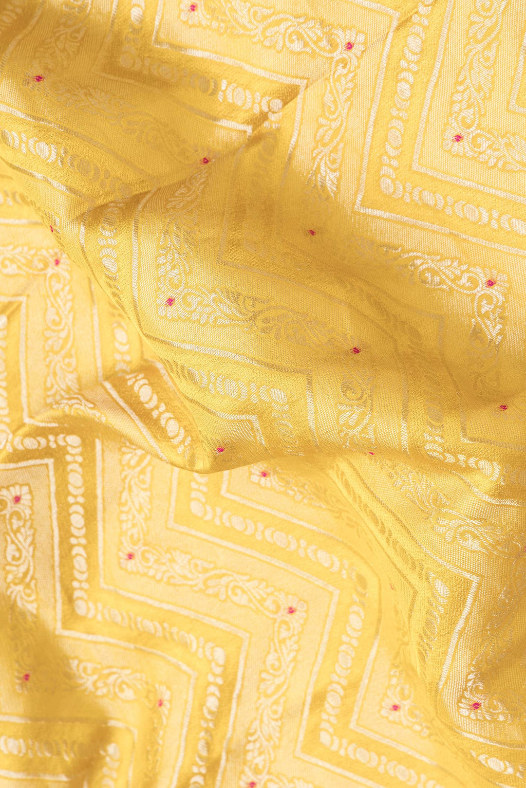 Close up of Yellow Dual Tone Banarasi Georgette Saree with Zari Brocade on the body and Zari Border.  displaying folds