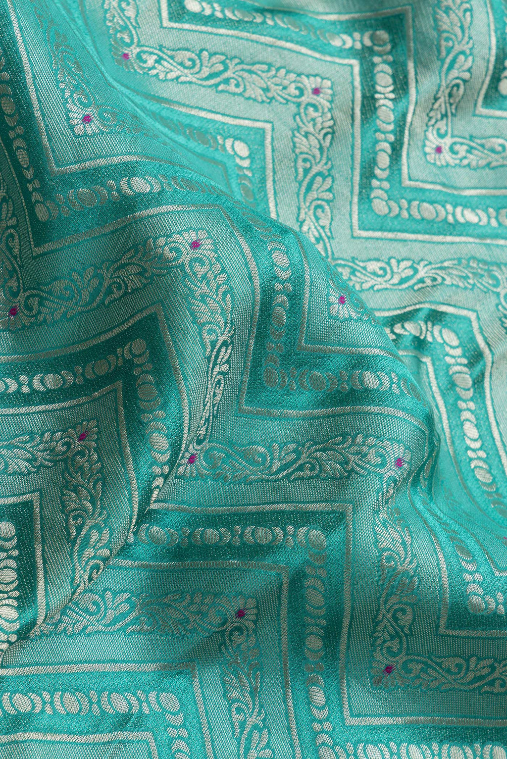 Close up of Sea Green Dual Tone Tussar Silk Saree with Zari Brocade on the body and Zari Border.  displaying folds
