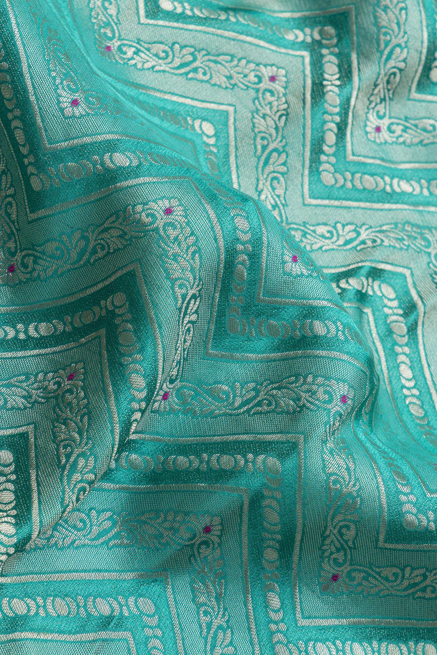 Close up of Sea Green Dual Tone Tussar Silk Saree with Zari Brocade on the body and Zari Border.  displaying folds