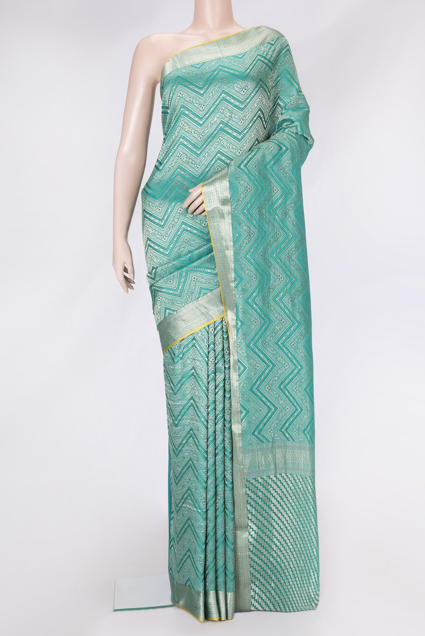 Sea Green Dual Tone Tussar Silk Saree with Zari Brocade on the body and Zari Border.  displayed on a mannequin