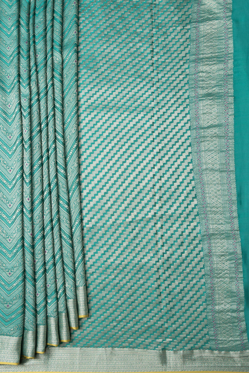 Pleats and pallu of Sea Green Dual Tone Tussar Silk Saree with Zari Brocade on the body and Zari Border. 