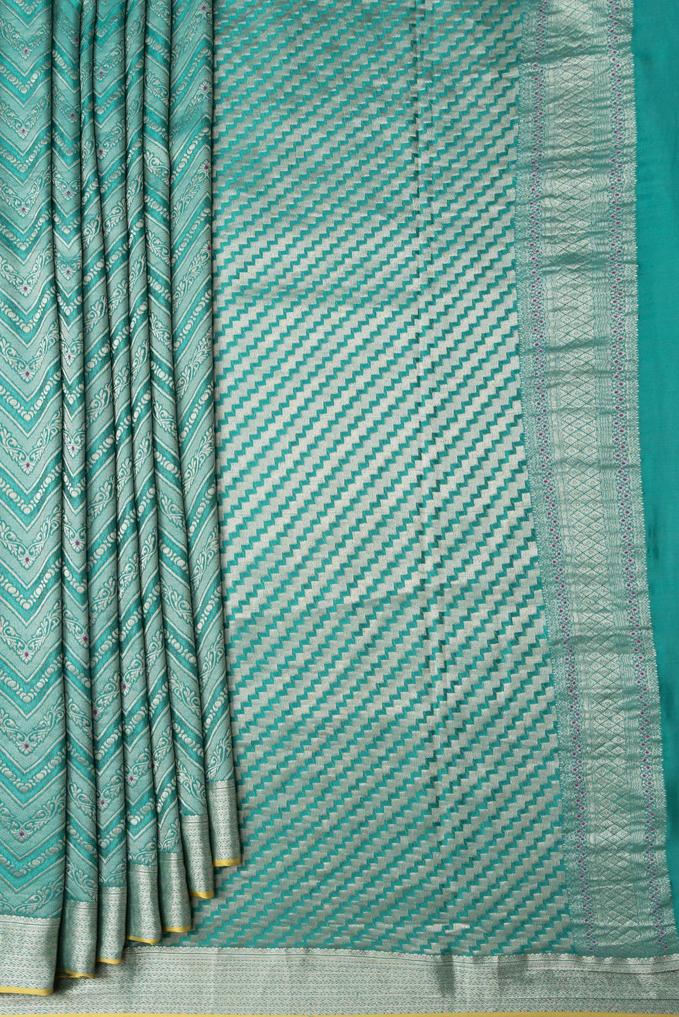 Pleats and pallu of Sea Green Dual Tone Tussar Silk Saree with Zari Brocade on the body and Zari Border. 