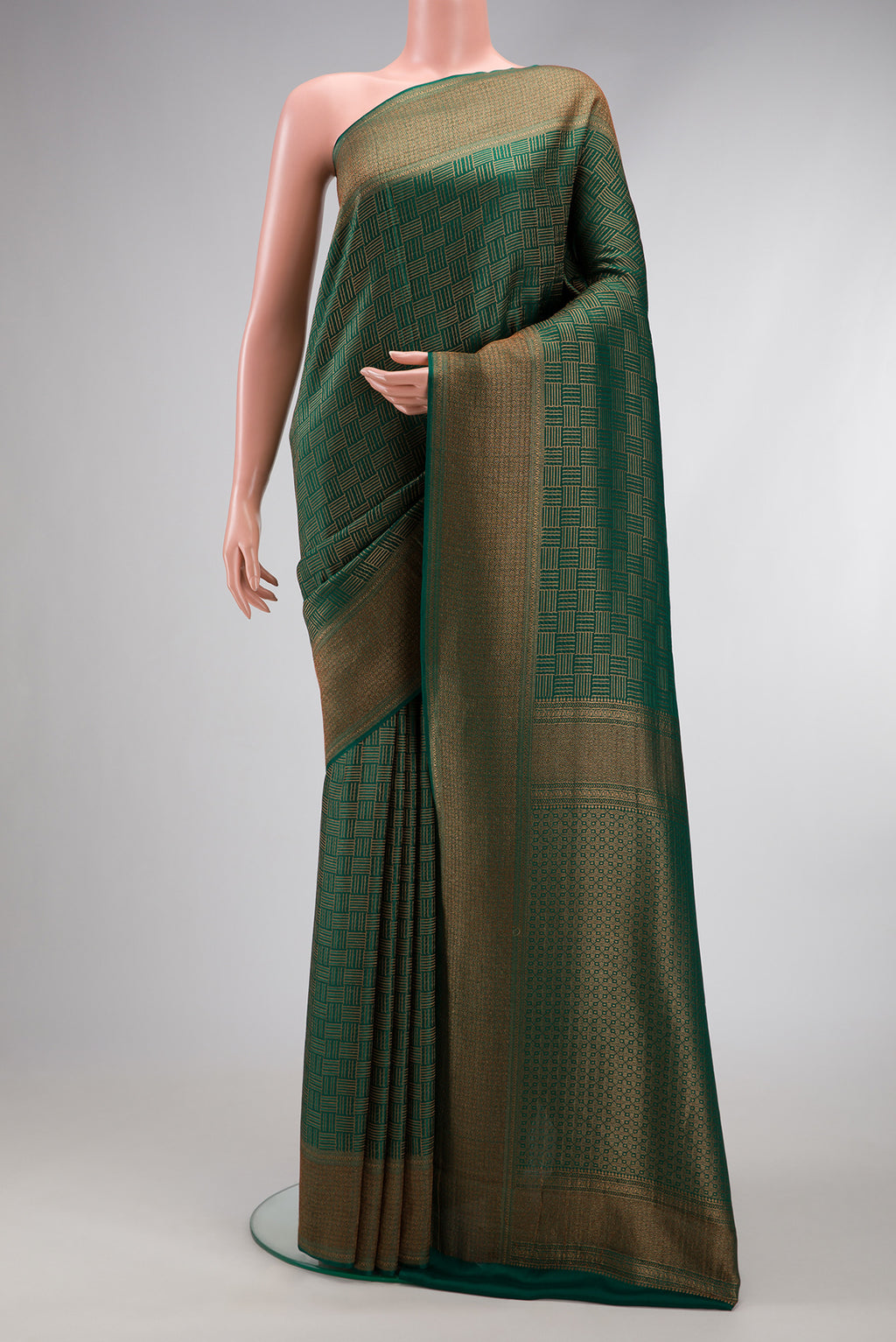 Bottle Green Dual Tone Mysore Crepe Saree with Zari Brocade on the body and Zari Border.  displayed on a mannequin