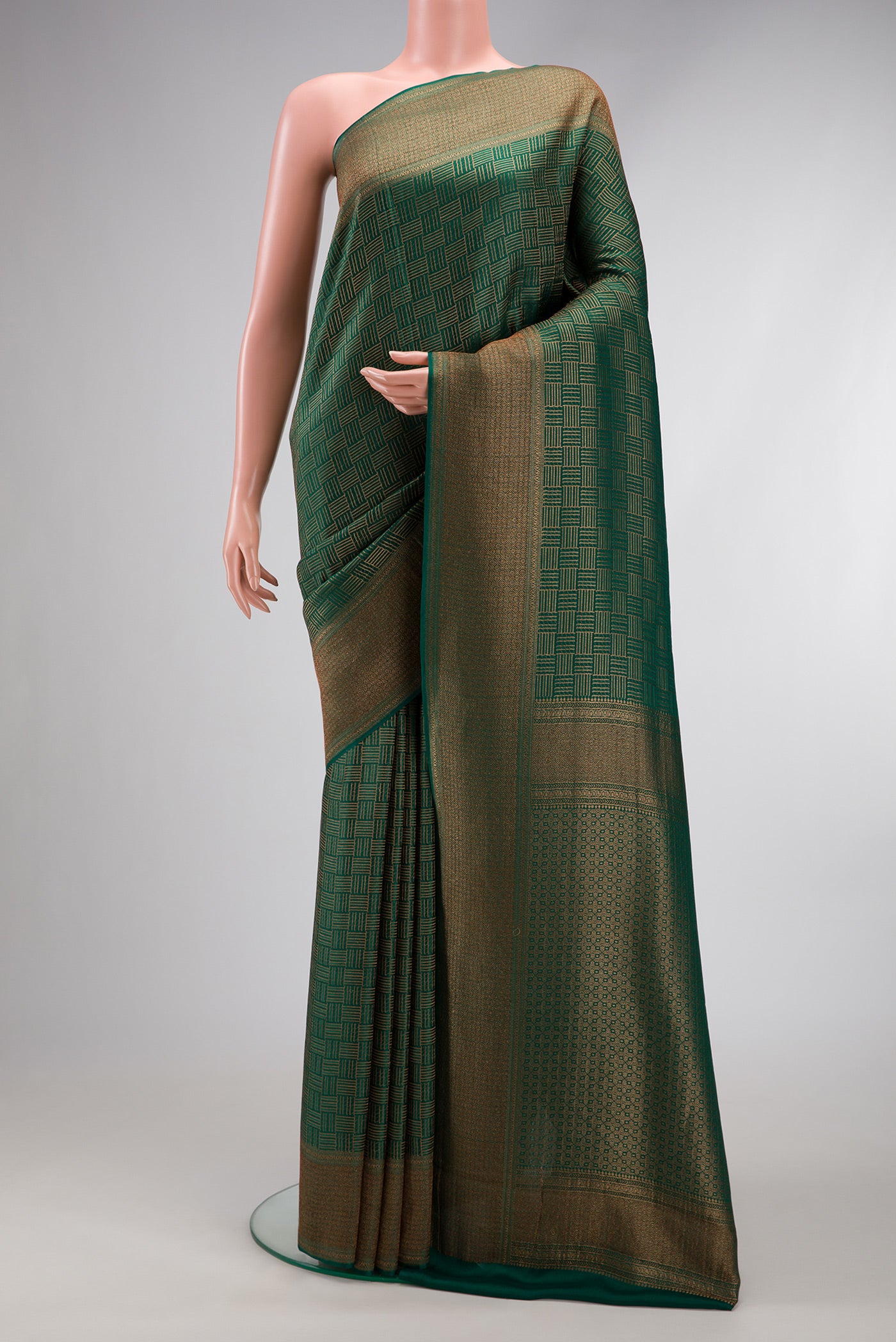 Bottle Green Dual Tone Mysore Crepe Saree with Zari Brocade on the body and Zari Border.  displayed on a mannequin