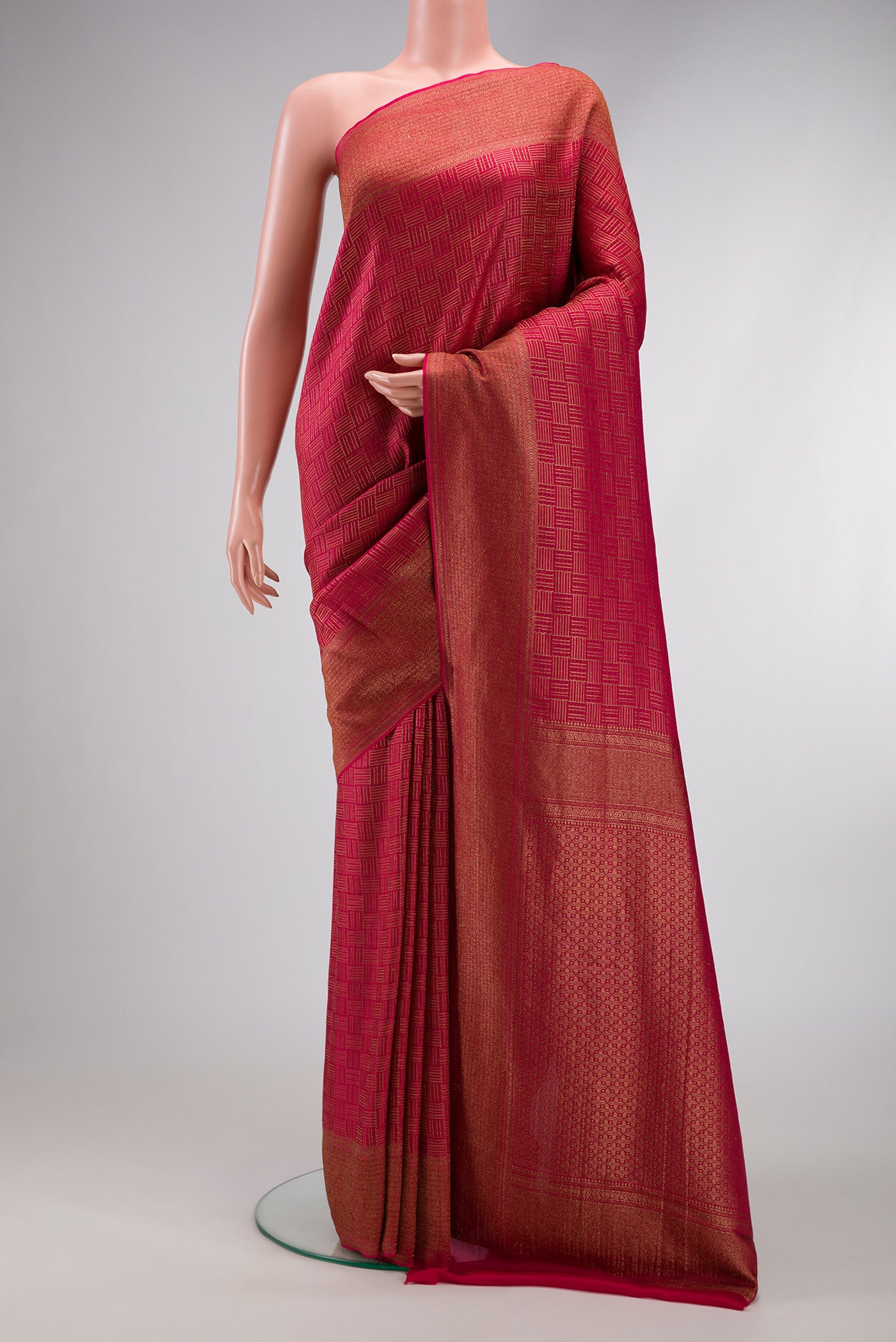 Dark Pink Mysore Crepe Saree with Zari Brocade on the body and Zari Border.  displayed on a mannequin