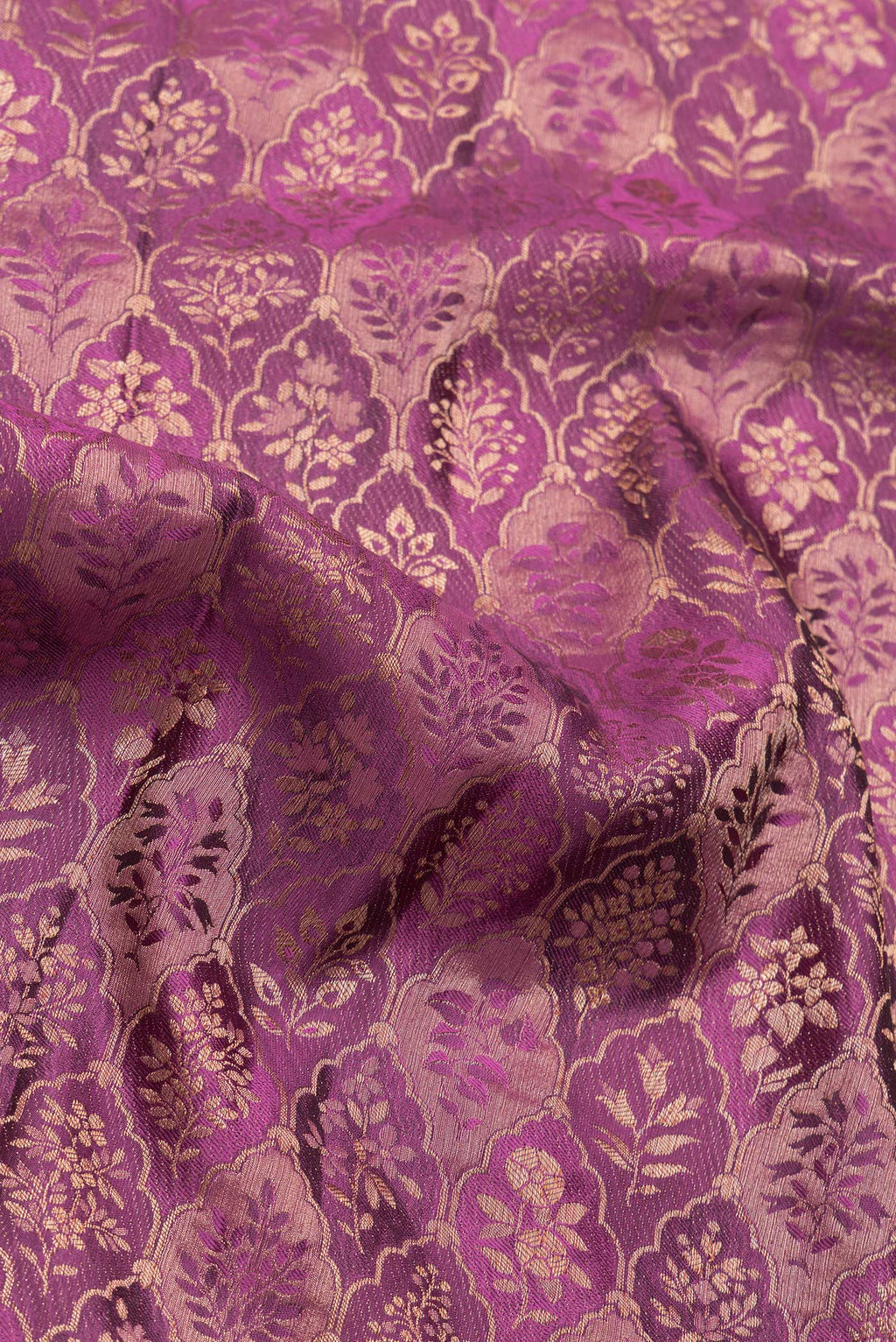 Close up of Magenta Dual Tone Banarasi Georgette Saree with Zari Brocade on the body and Zari Border.  displaying folds