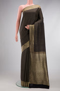 Black Mysore Crepe Saree with Stripes on the body and Zari Border.  displayed on a mannequin