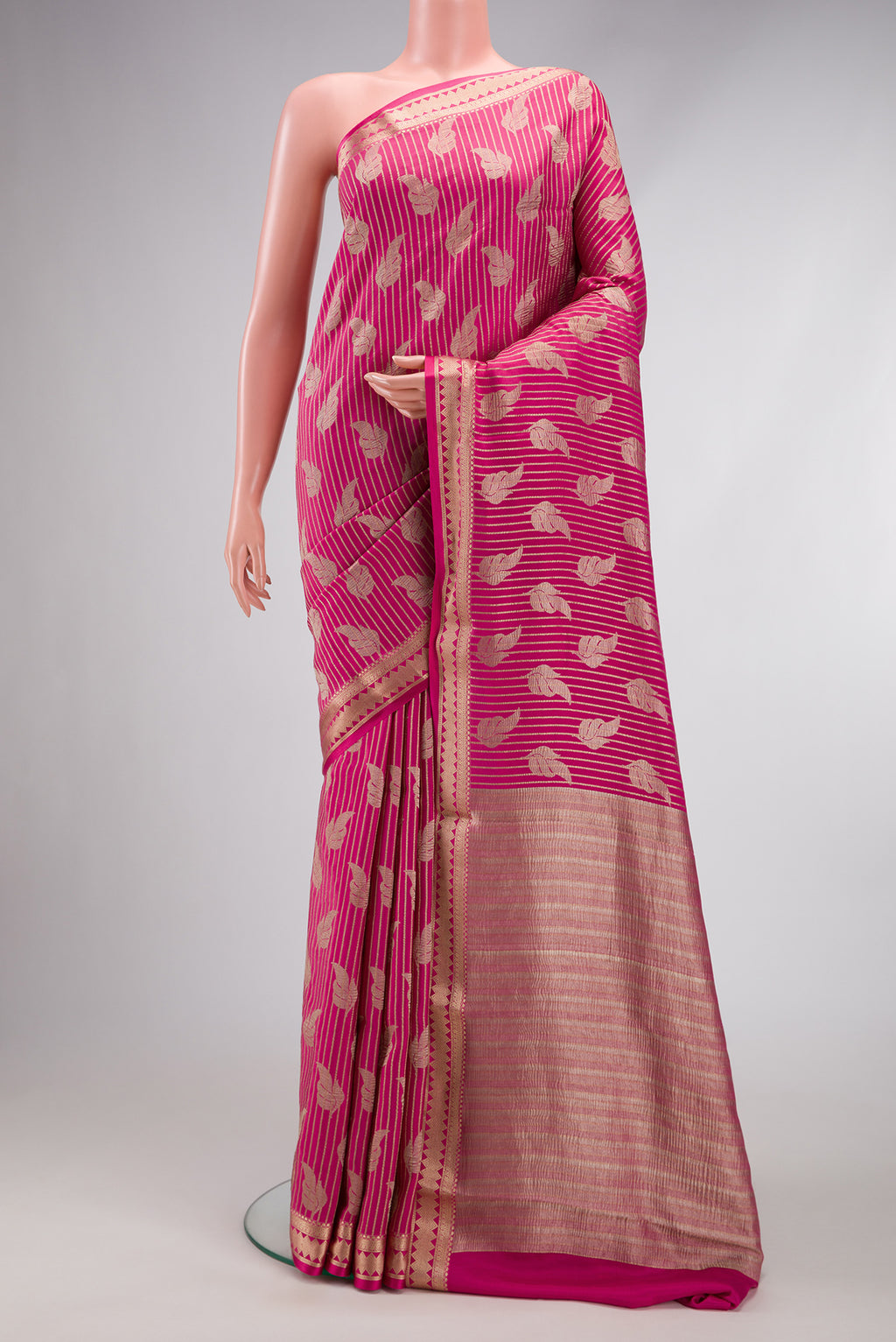 Pink Mysore Crepe Saree with Stripes on the body and Zari Border.  displayed on a mannequin