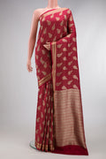 Maroon Banarasi Georgette Saree with Zari Brocade on the body and Zari Border.  displayed on a mannequin