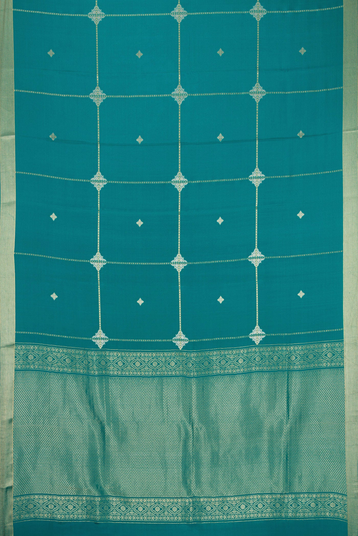 Flat view of Peacock Blue Dual Tone Mysore Crepe Saree with Stripes on the body and Zari Border. 