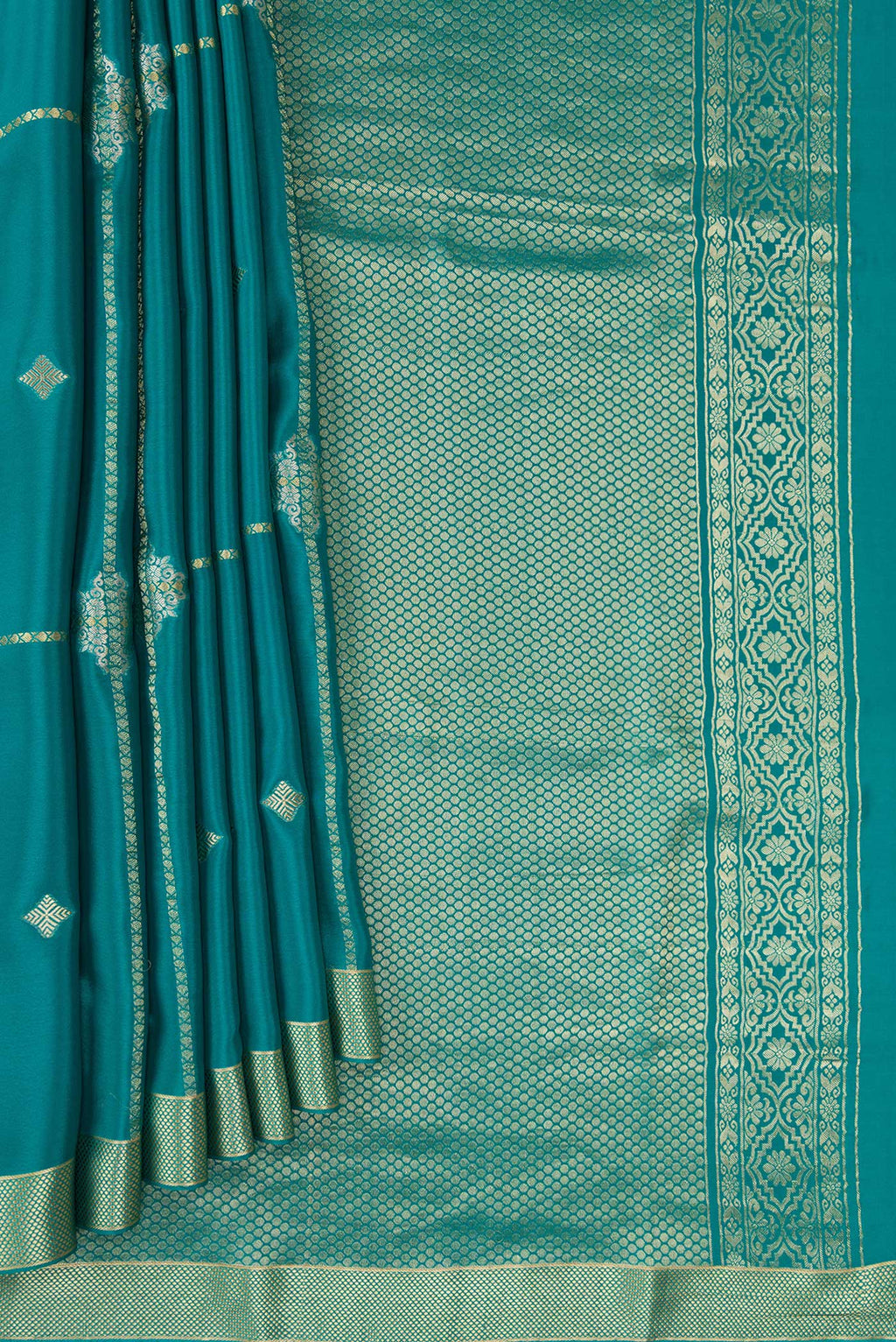 Pleats and pallu of Peacock Blue Dual Tone Mysore Crepe Saree with Stripes on the body and Zari Border. 