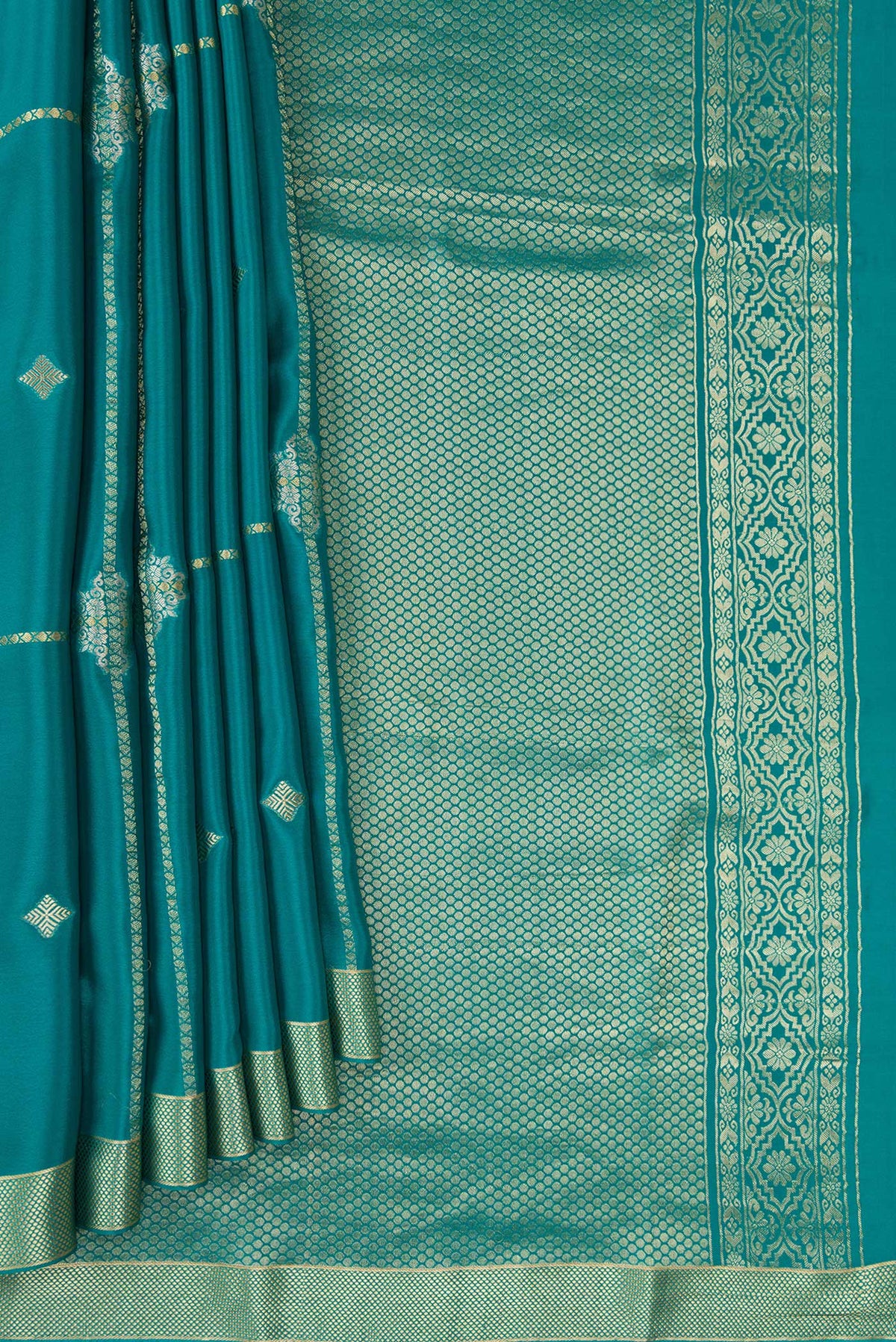Pleats and pallu of Peacock Blue Dual Tone Mysore Crepe Saree with Stripes on the body and Zari Border. 