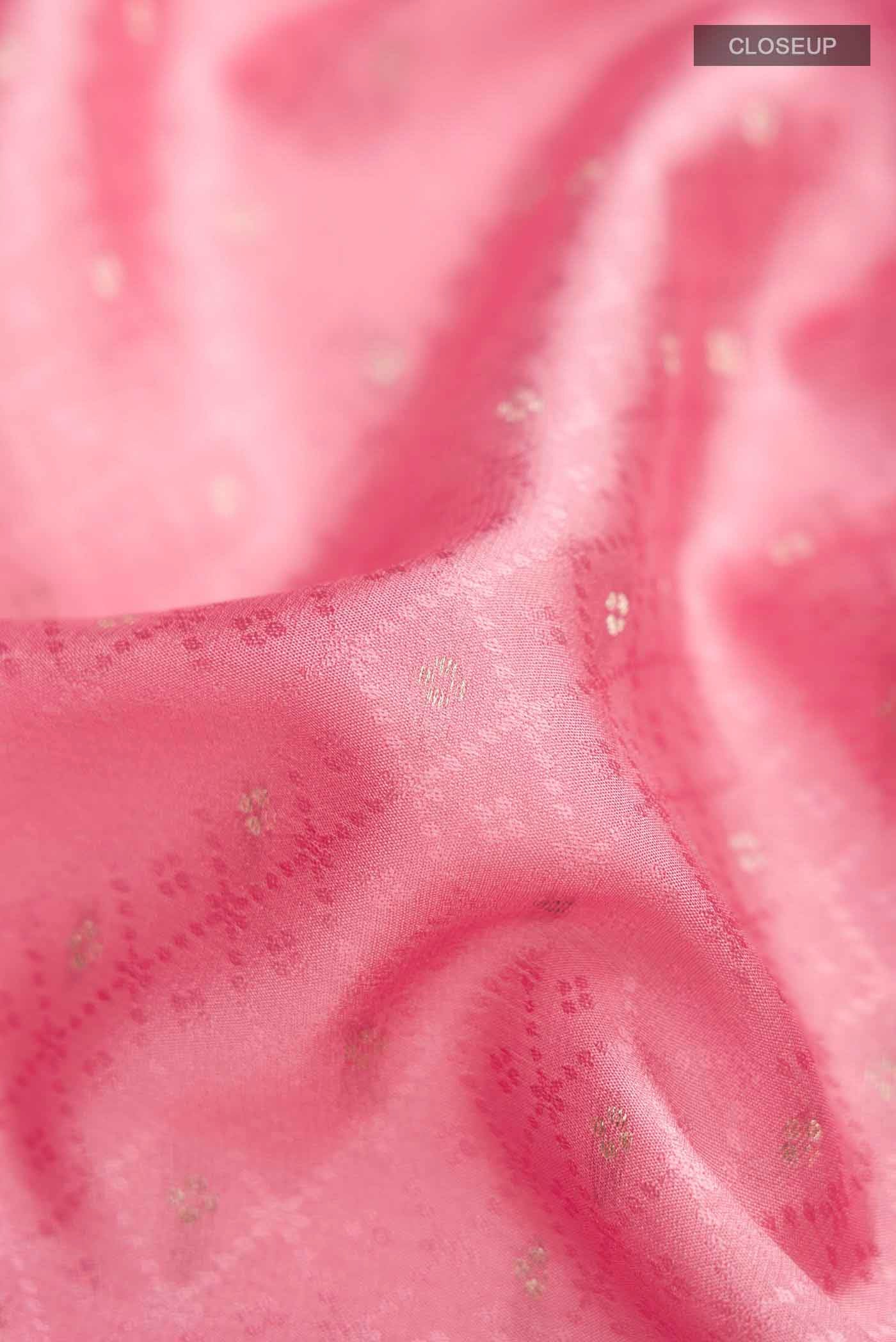 Close up of Pink Mysore Crepe Saree with Jacquard With Zari Butta on the body and Zari Border displaying folds