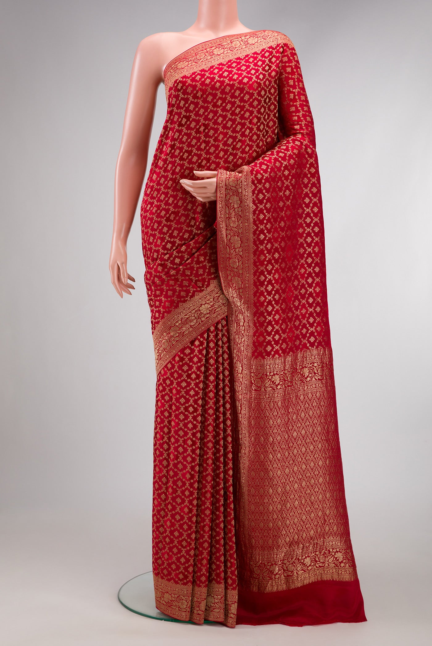 Maroon Dual Tone Georgette Saree with Zari Brocade on the body and Zari Border.  displayed on a mannequin