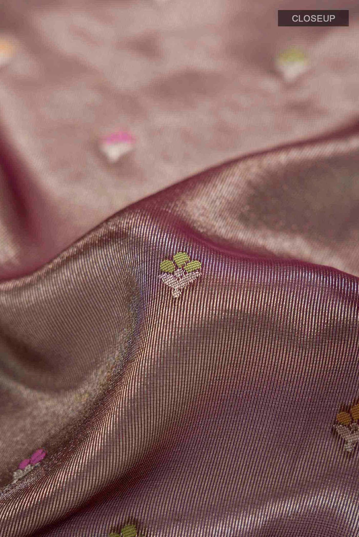 Close up of Brown Banarasi Silk Saree with Zari Butta on the body and Zari Border displaying folds