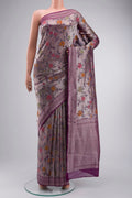 Purple Tissue Silk Saree with Zari Brocade on the body and Zari Border displayed on a mannequin