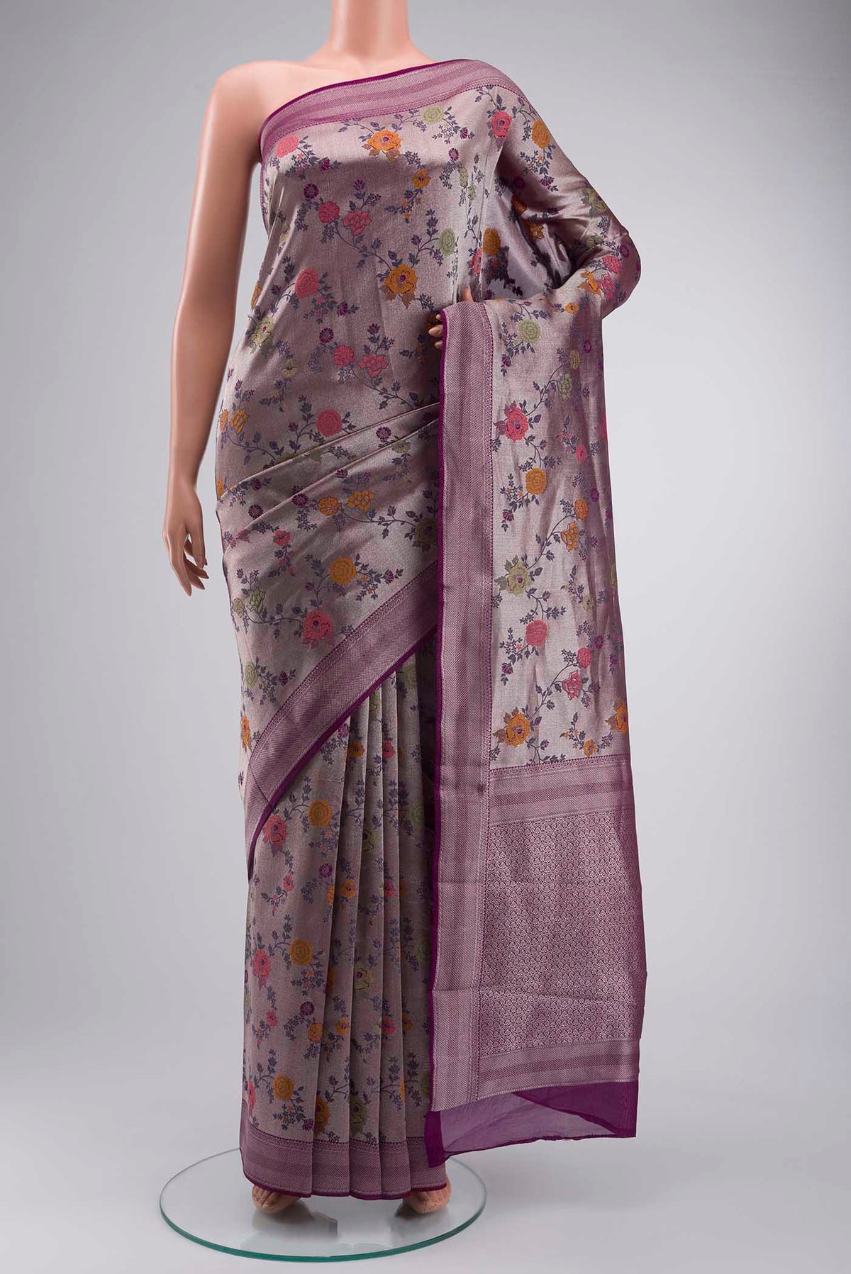 Purple Tissue Silk Saree with Zari Brocade on the body and Zari Border displayed on a mannequin