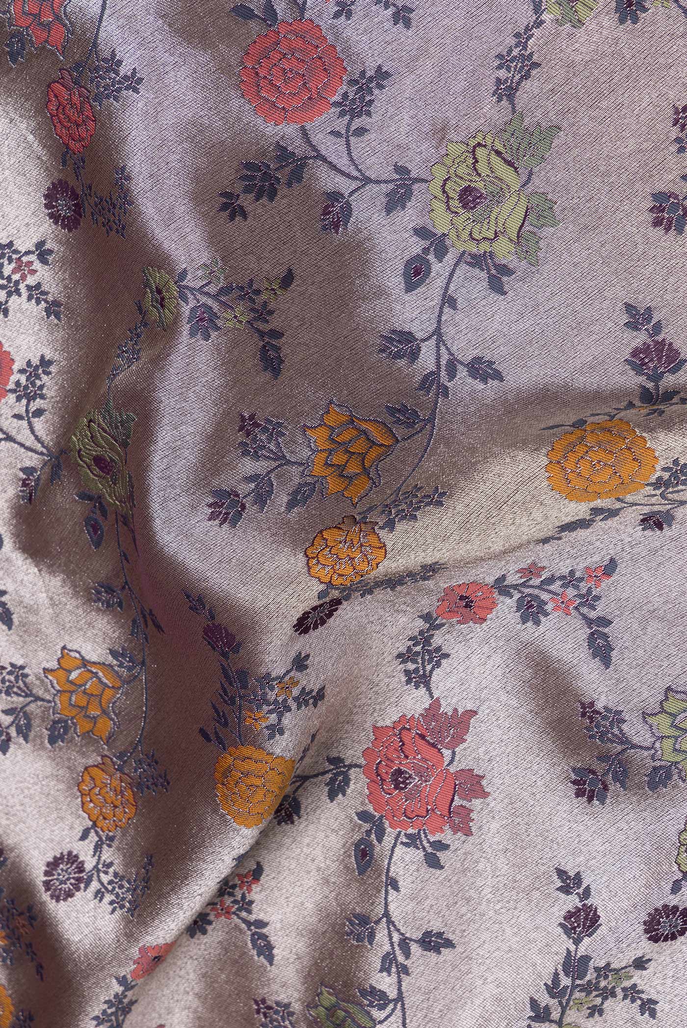 Close up of Purple Dual Tone Organza Silk Saree with Zari And Thread Butta on the body and Zari Border.  displaying folds